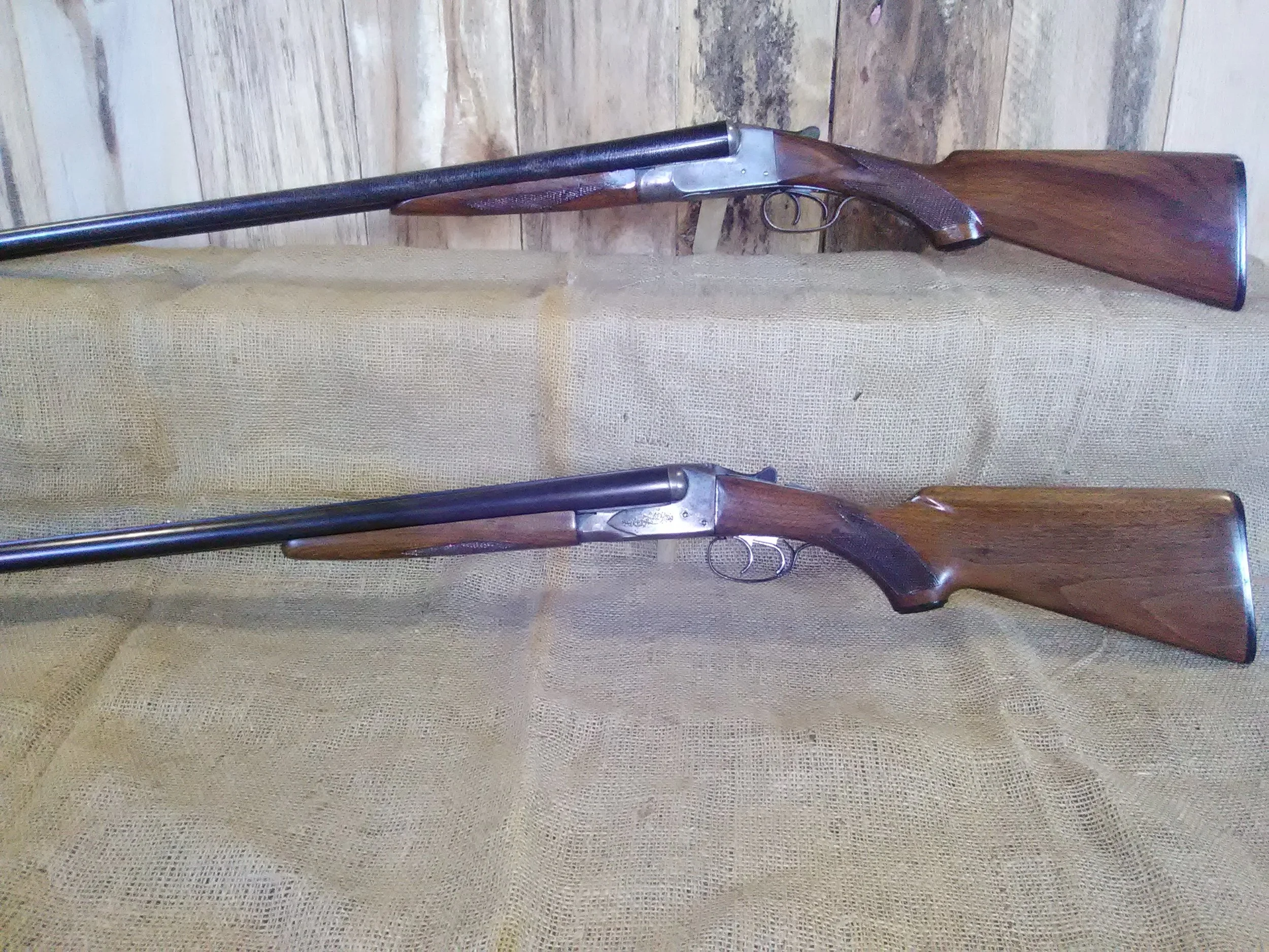 The two refinished shotguns, side by side. Ithaca on top and Savage on bottom. 