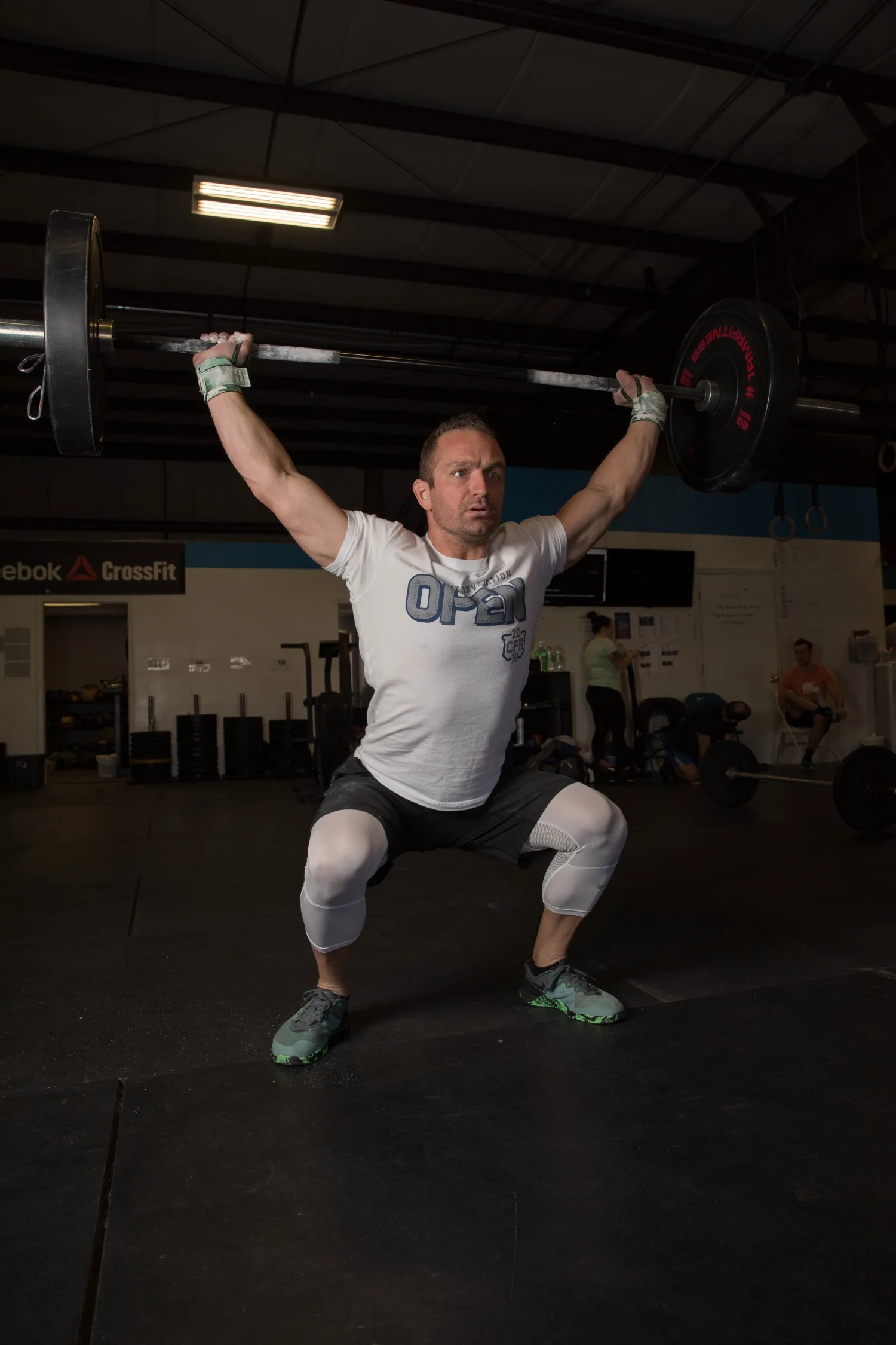 Rome Athletics Man Overhead Barbell Squat Fitness.jpg