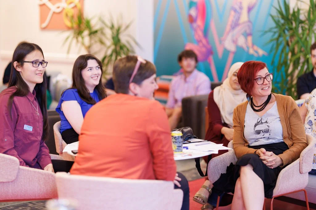 Event participants gather with the team at See What I Mean, a nonprofit and philanthropy consulting organization