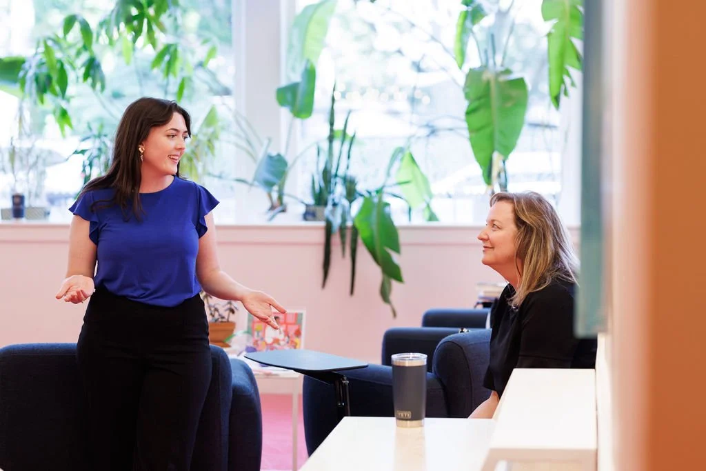 Philanthropy consultant Stacy Van Gorp and See What I Mean facilitator Jenna Hoover talk at an event
