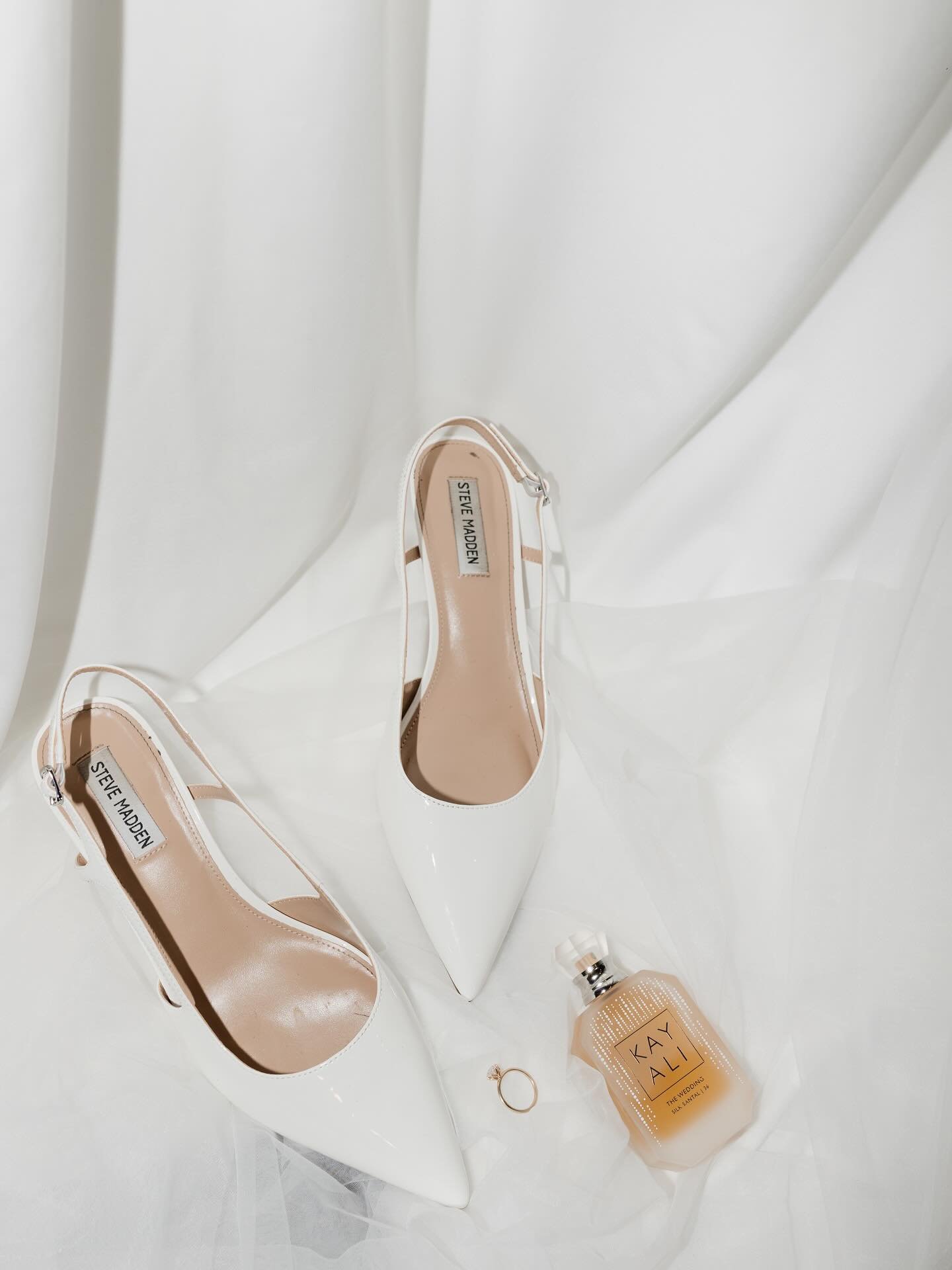 Because the details deserve to have their moment too.
&bull;
Patent leather heels catching the light just right. A spritz of something sultry. His watch laid down with intention. A pop of champagne and a dress that waits quietly, ready to steal the s