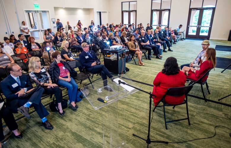  Gideon Bernstein and his wife, Jeanne Pepper Bernstein, right front, speaks with Norma Lopez, left front, executive director of OC Human Relations Commission, about their son, Blaze Bernstein, who was murdered in January 2018, as officials release t