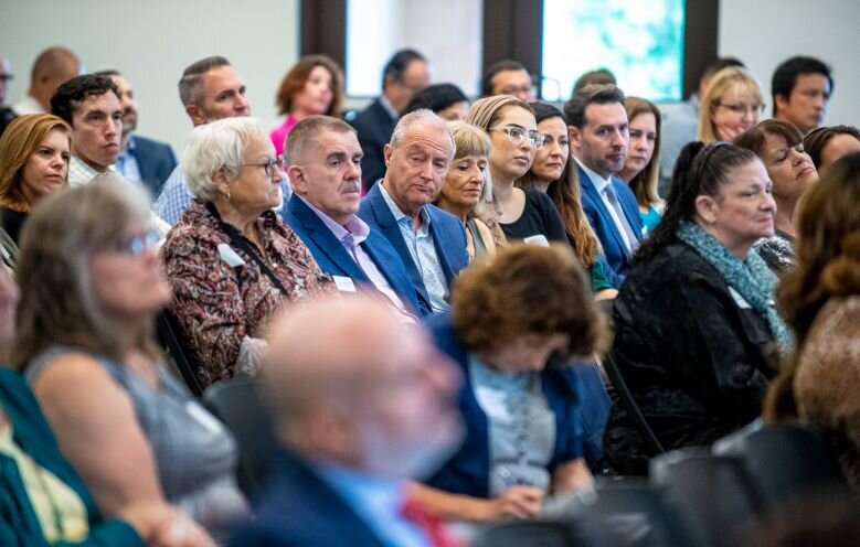  Audience members listen as Gideon Bernstein as his wife, Jeanne Pepper Bernstein, speak about their son, Blaze Bernstein, who was murdered in January 2018, as officials release the latest report on hate crimes in Orange County for 2018, on Thursday 