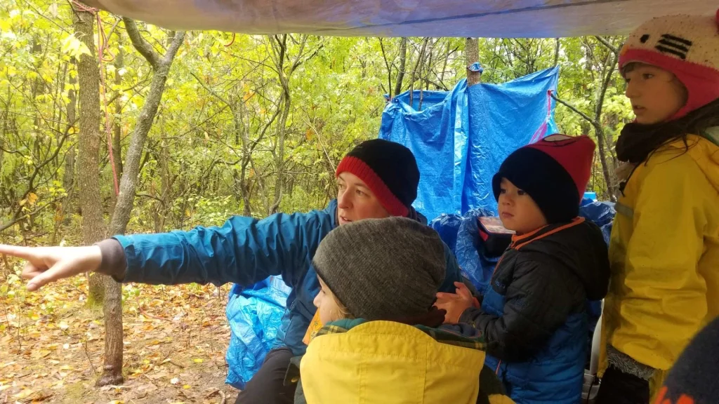 Founder & Executive Director, Bethany Beaudry observing wildlife with some learners in the outdoor classroom