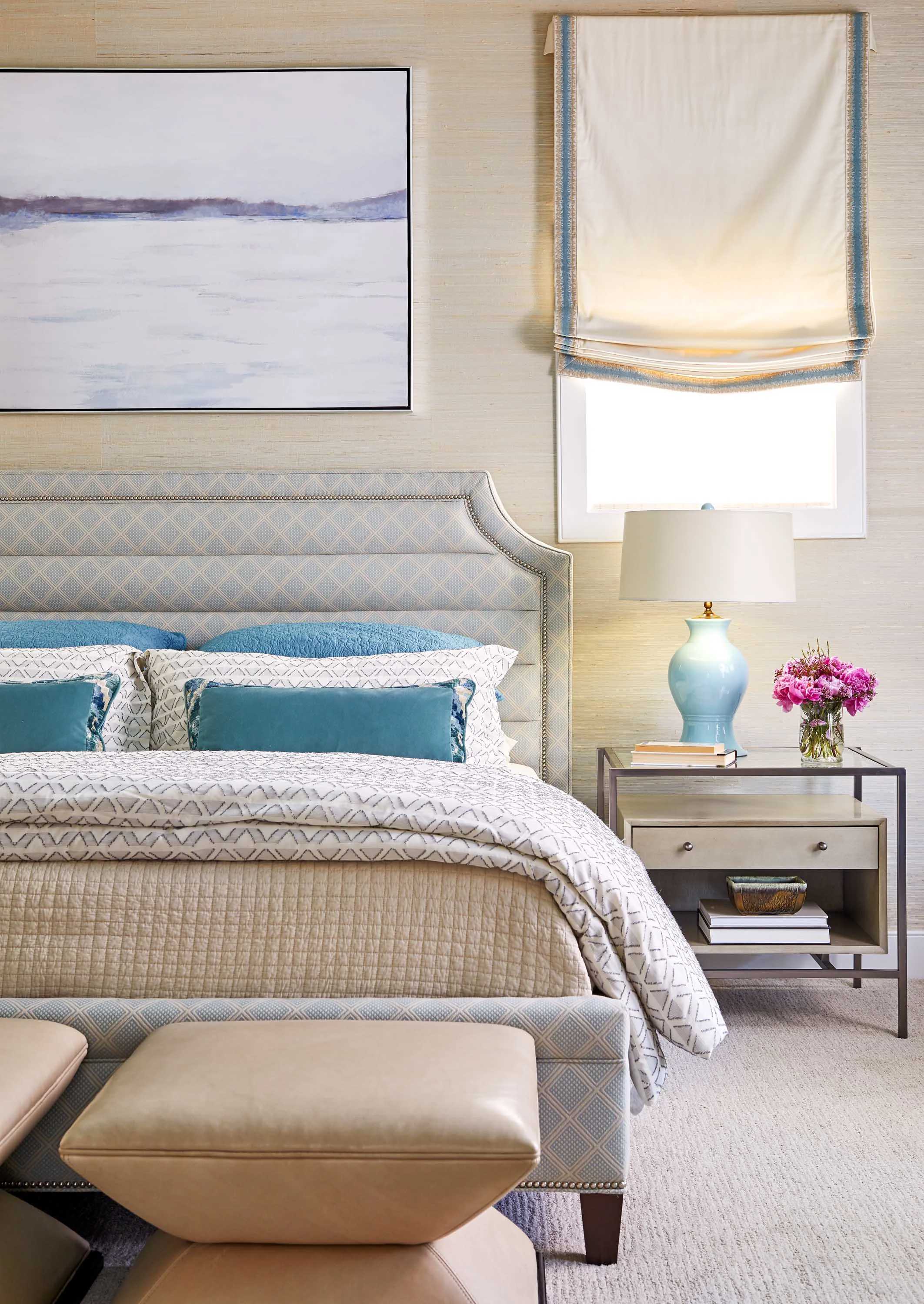 Luxurious bedroom with blue pillows and bedside lamp best of Boston Cambridge DC top-designers Dane Austin Design