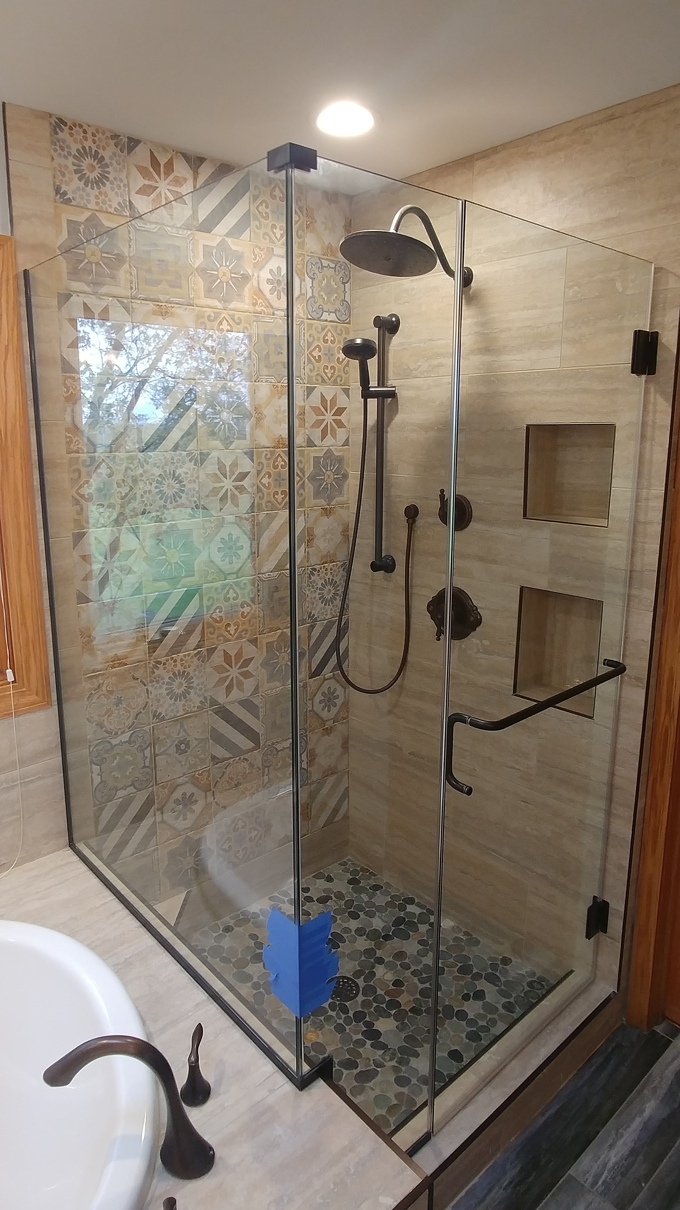 Full Glass Enclosure of a Mosaic Style Shower 