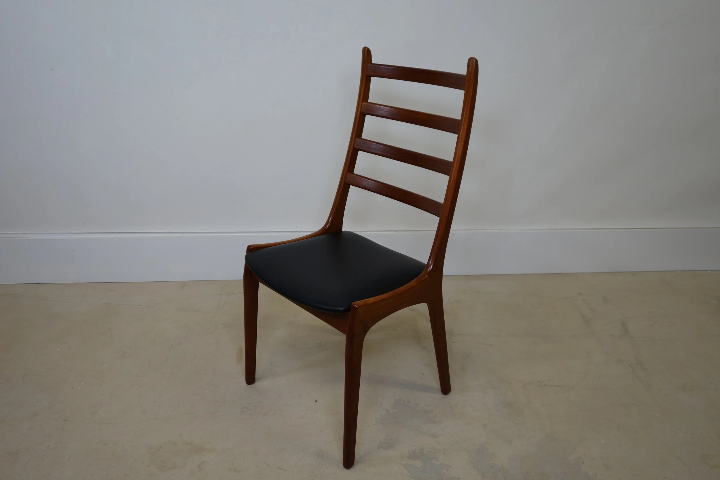 teak dining chairs by Kai kristiansen