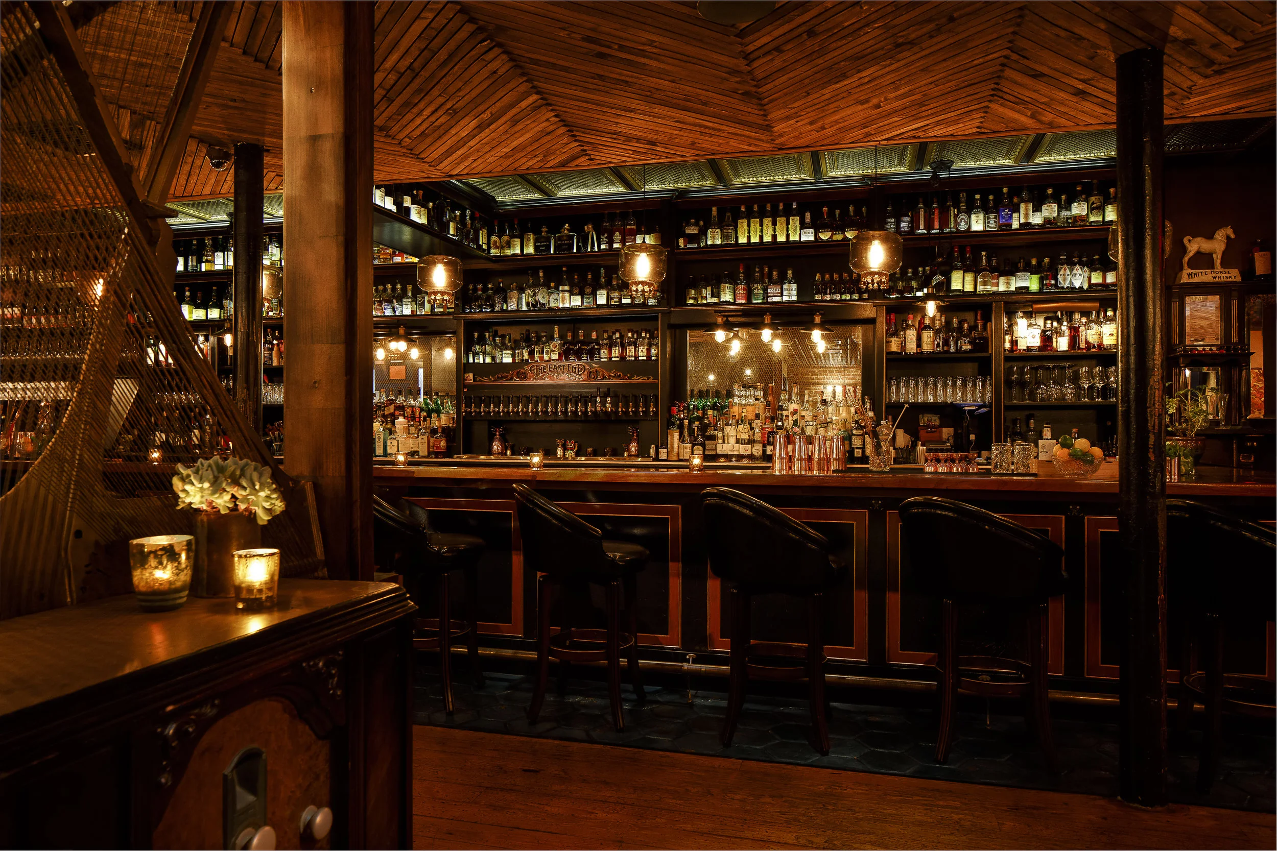 East End has Victorian whiskey bar ambiance with tin ceilings and rich velvet drapes, plus a bar highlighting an extensive spirits selection