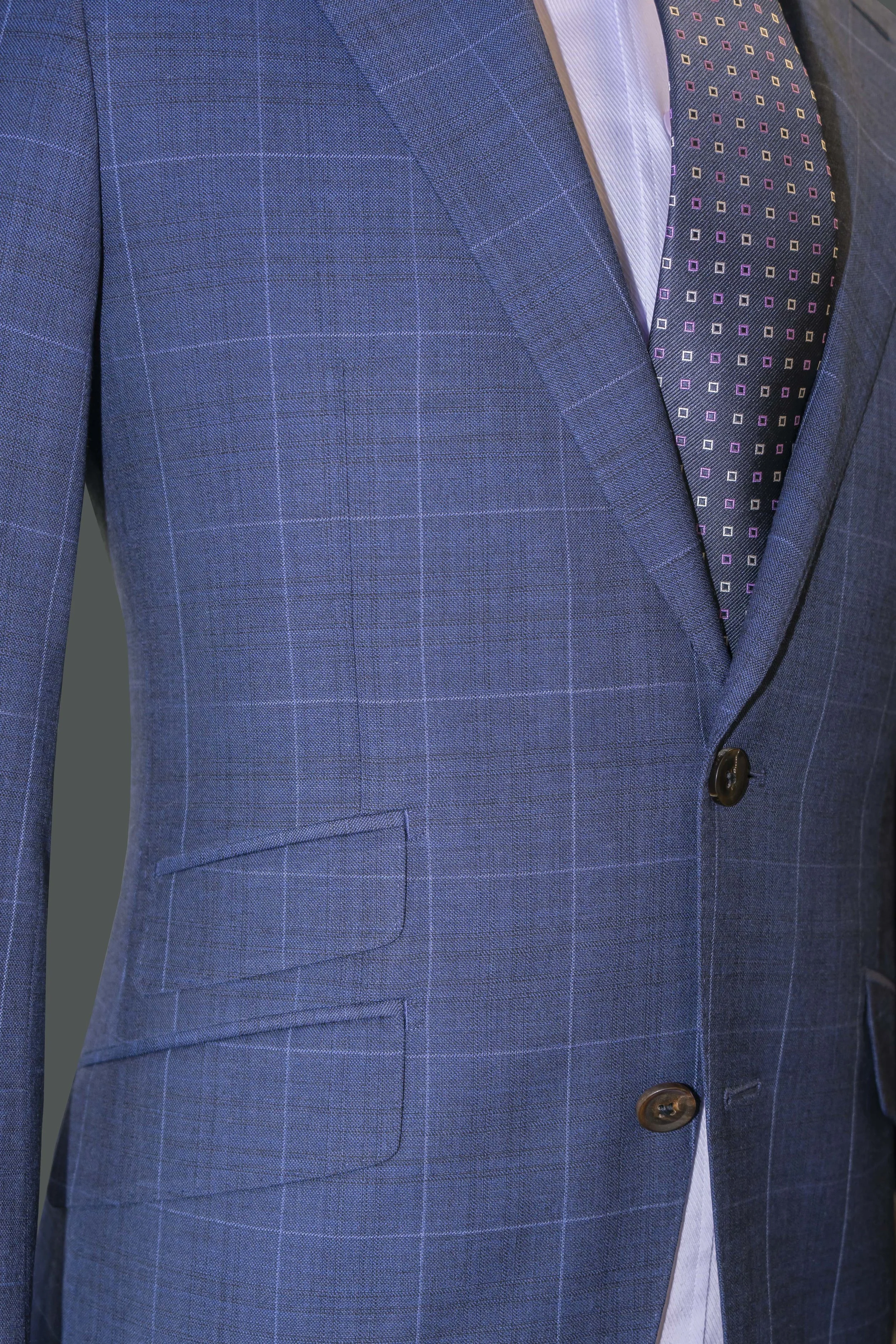 Ticket pocket available on our Blue Plaid Suit and Admiral Blue Special Occasion Suit. Flattering cutaway jacket opening on all garments.