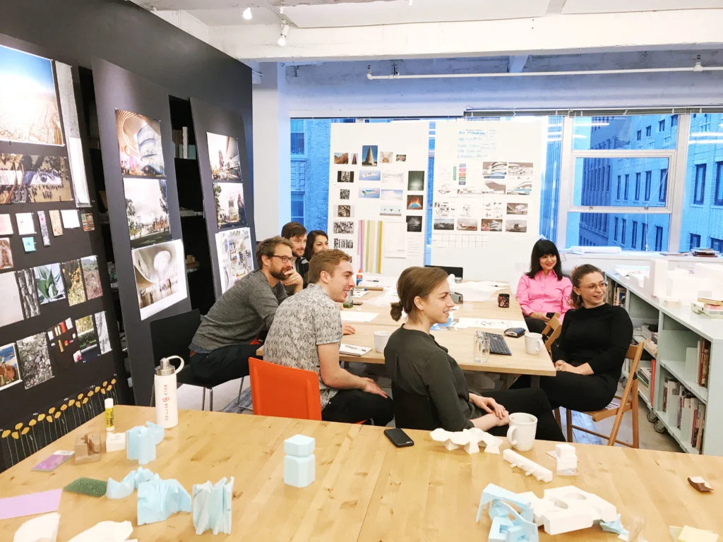 Elaine in a meeting with junior staff