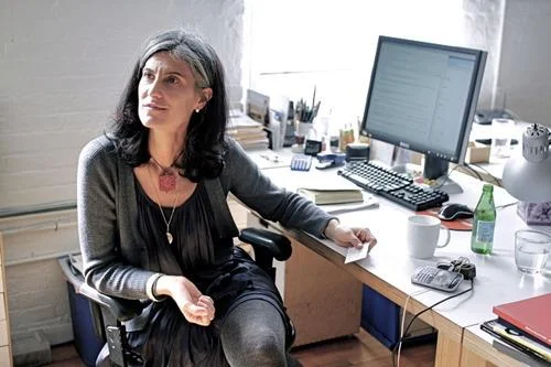 Galia at her Solomonoff Architecture Studio's desk, 2013.