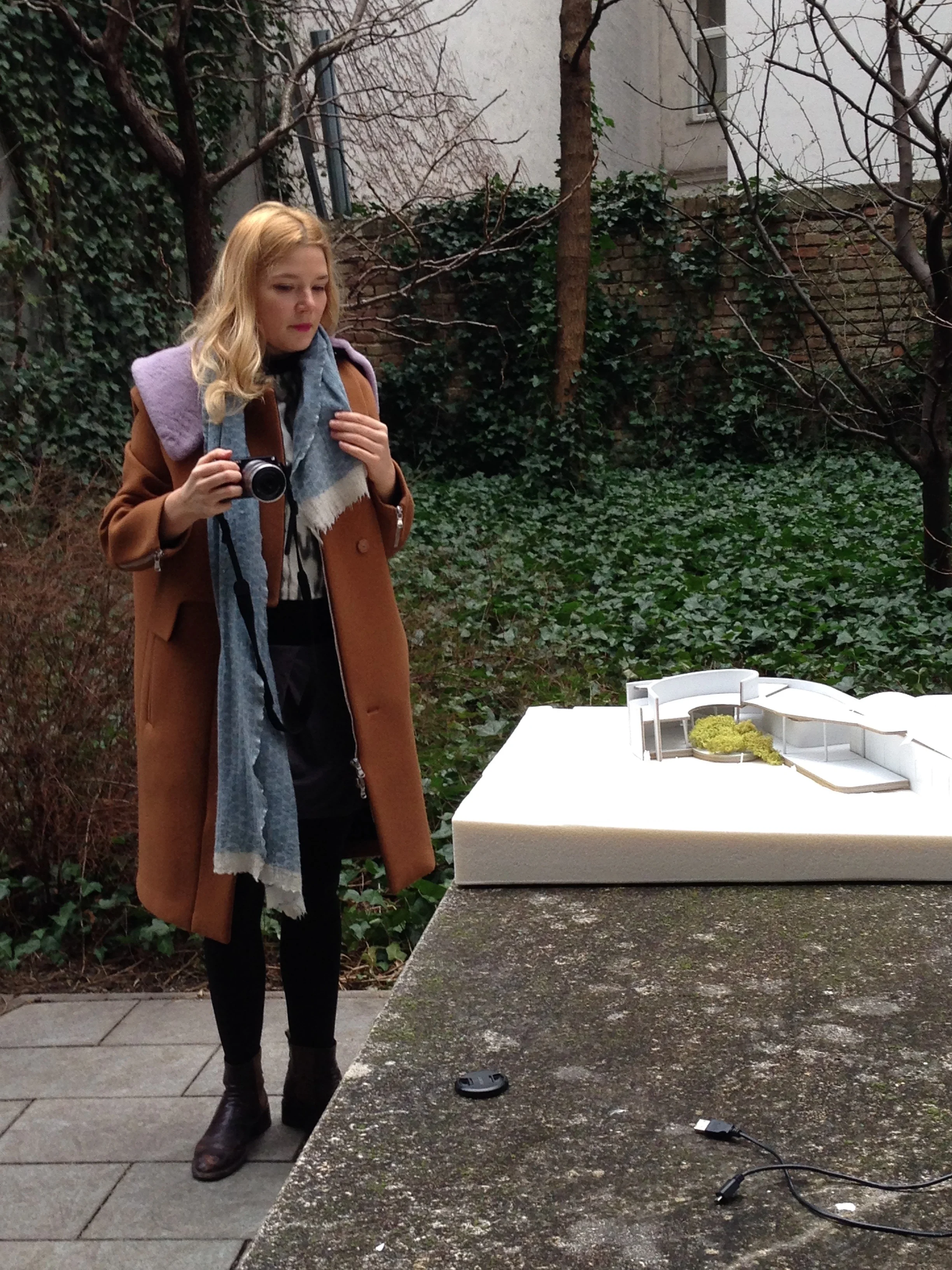 Bika photographing an architecture model for her first commission, in Vienna 2016
