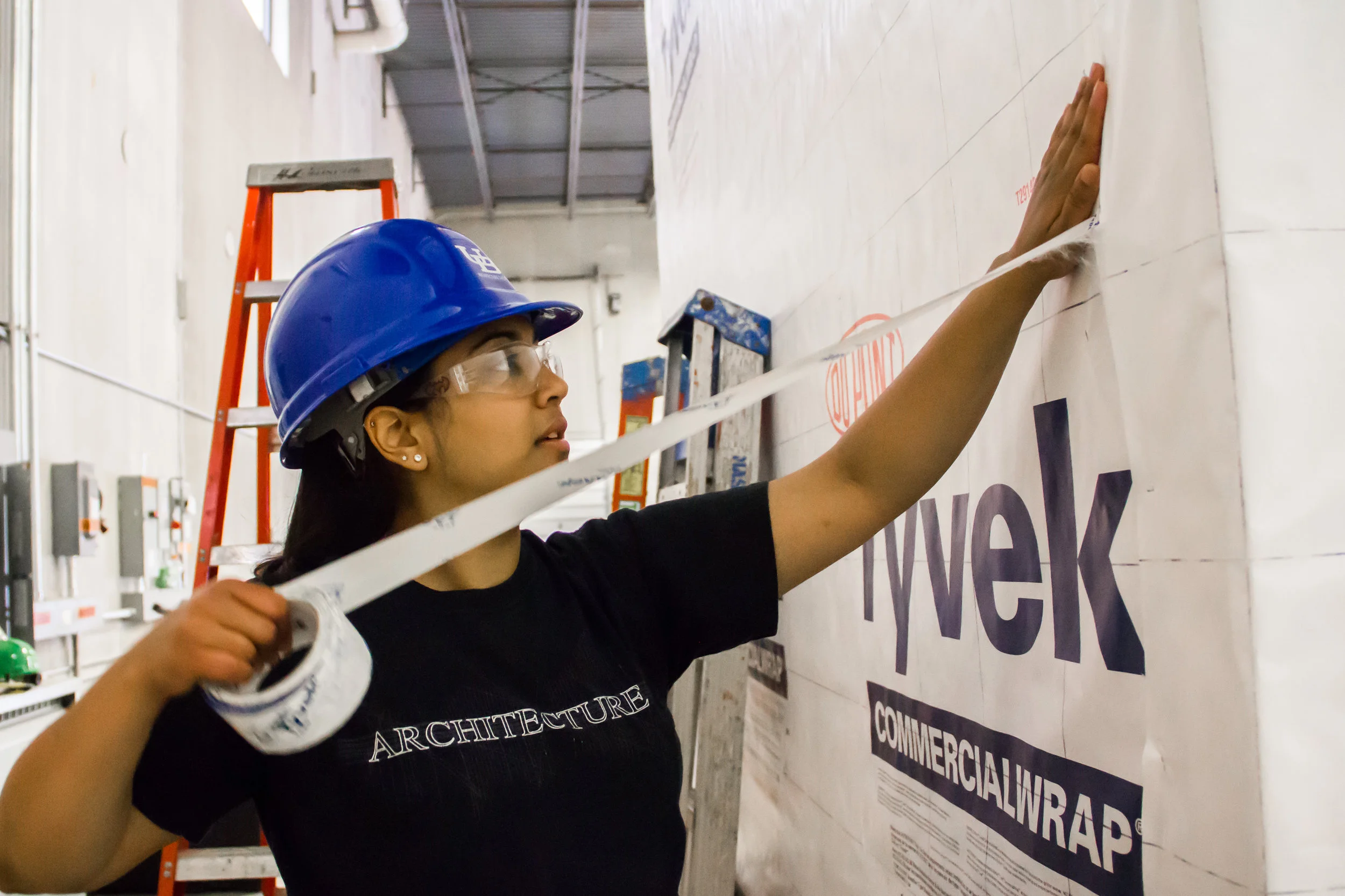Pooja Bhatt, a University at Buffalo architecture graduate student, helping to construct the GRoW Home, the school’s entry in the 2015 U.S. Department of Energy’s Solar Decathlon. Photograph by Zhi Ting.