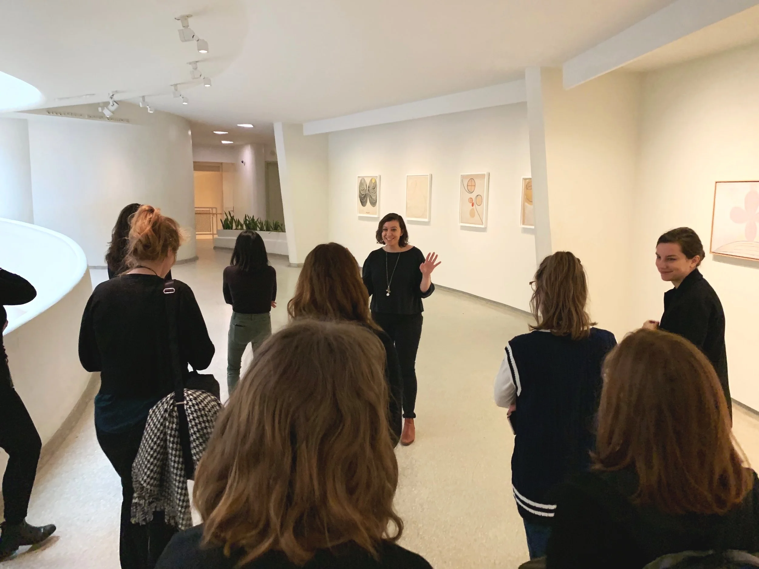 Ashley giving a building tour to staff at the museum