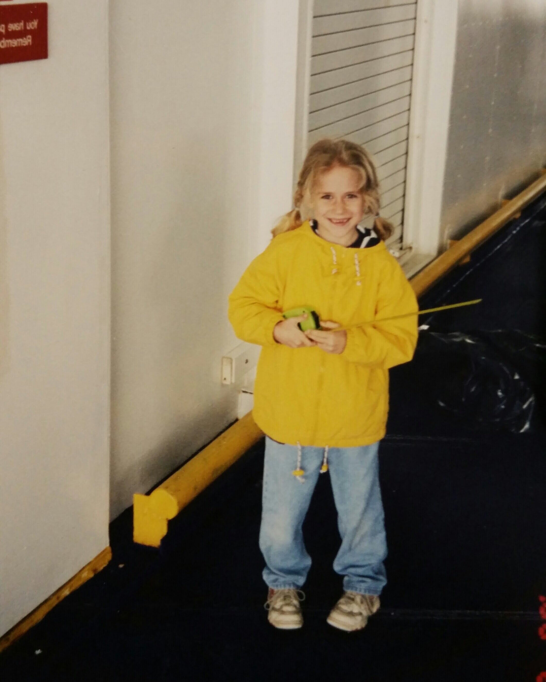 Hannah as a child, about to measure the dimensions of a ship’s elevator on her first ship survey with her dad.