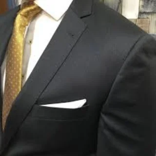 Charcoal mens suit with gold tie