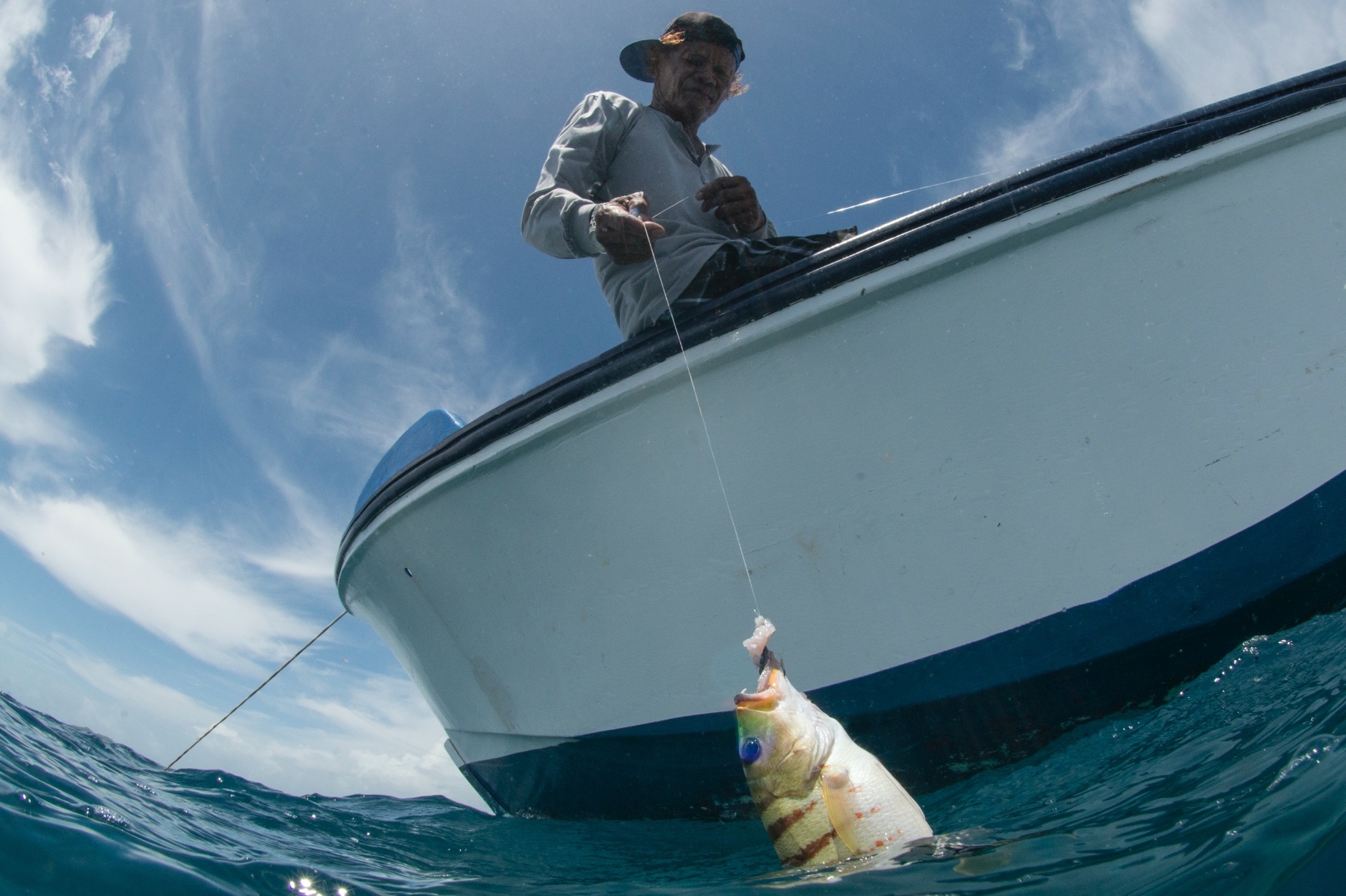 FISHERMAN IN PALAU CREDIT: THE OCEAN AGENCY / coral reef image bank