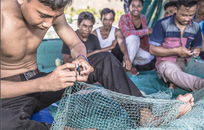 fisherman mending lines in indonesia credit: Martin Colognoli / coral reef image bank