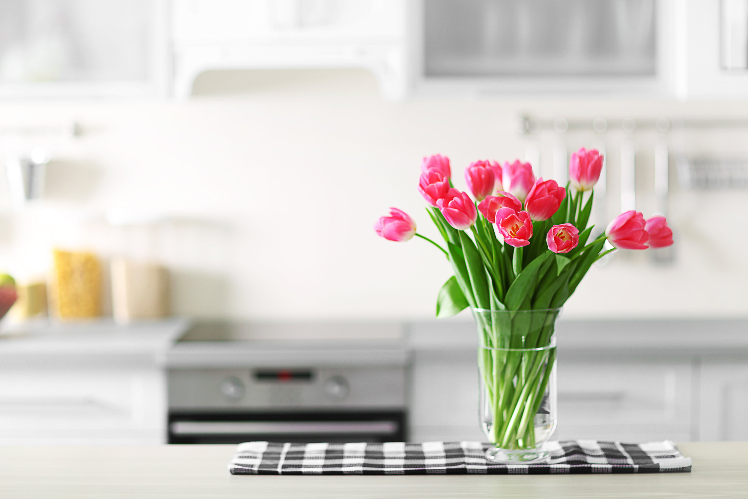 bigstock-Fresh-bouquet-of-tulips-on-a-k-121458953.jpg