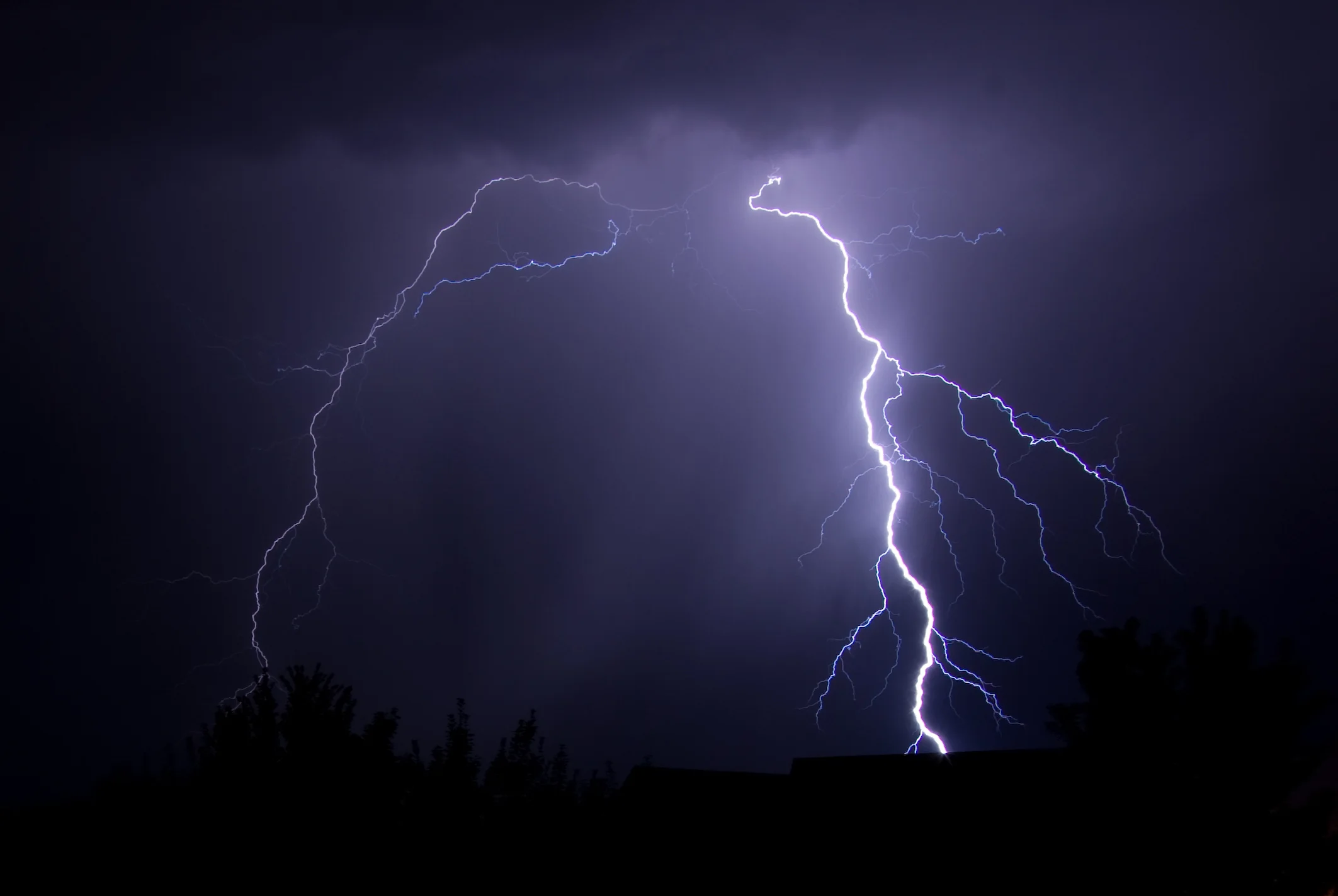 Lightning striking on a dark night sky