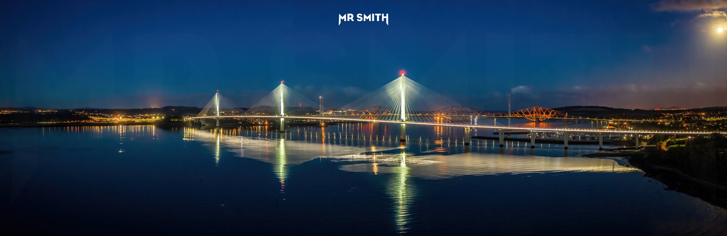 Aerial panorama of Queensferry Crossing at night