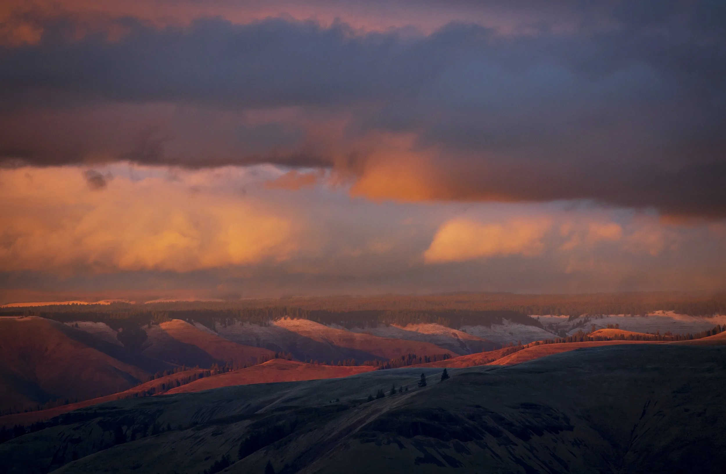  The setting sun casts a warm glow across the landscape Tuesday, Nov. 23. 2021, in the foothills of the Blue Mountains near Deadman Pass southeast of Pendleton. 