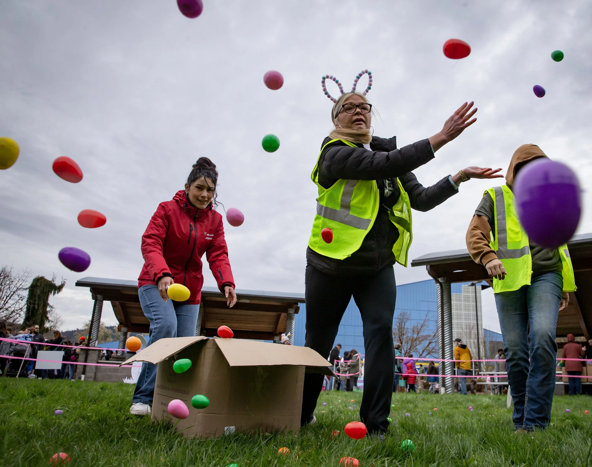  Volunteers spread eggs between hunts at Willamalane’s annual “Megga” Easter egg hunt at Lively Park in Springfield Saturday, April 8, 2023.  
