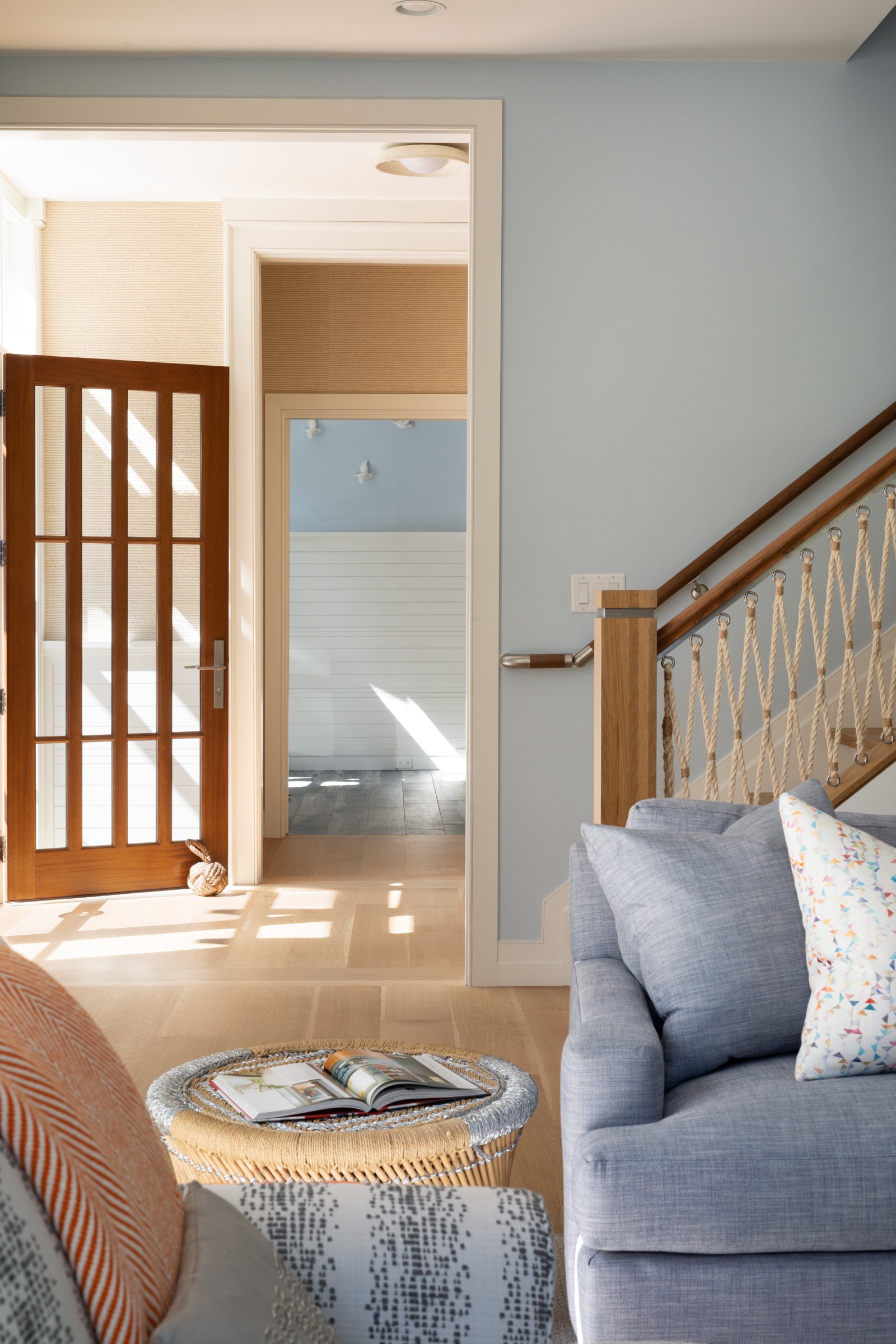 entryway-cape-house-architecture-warm-wood--nautical-bannister.jpg