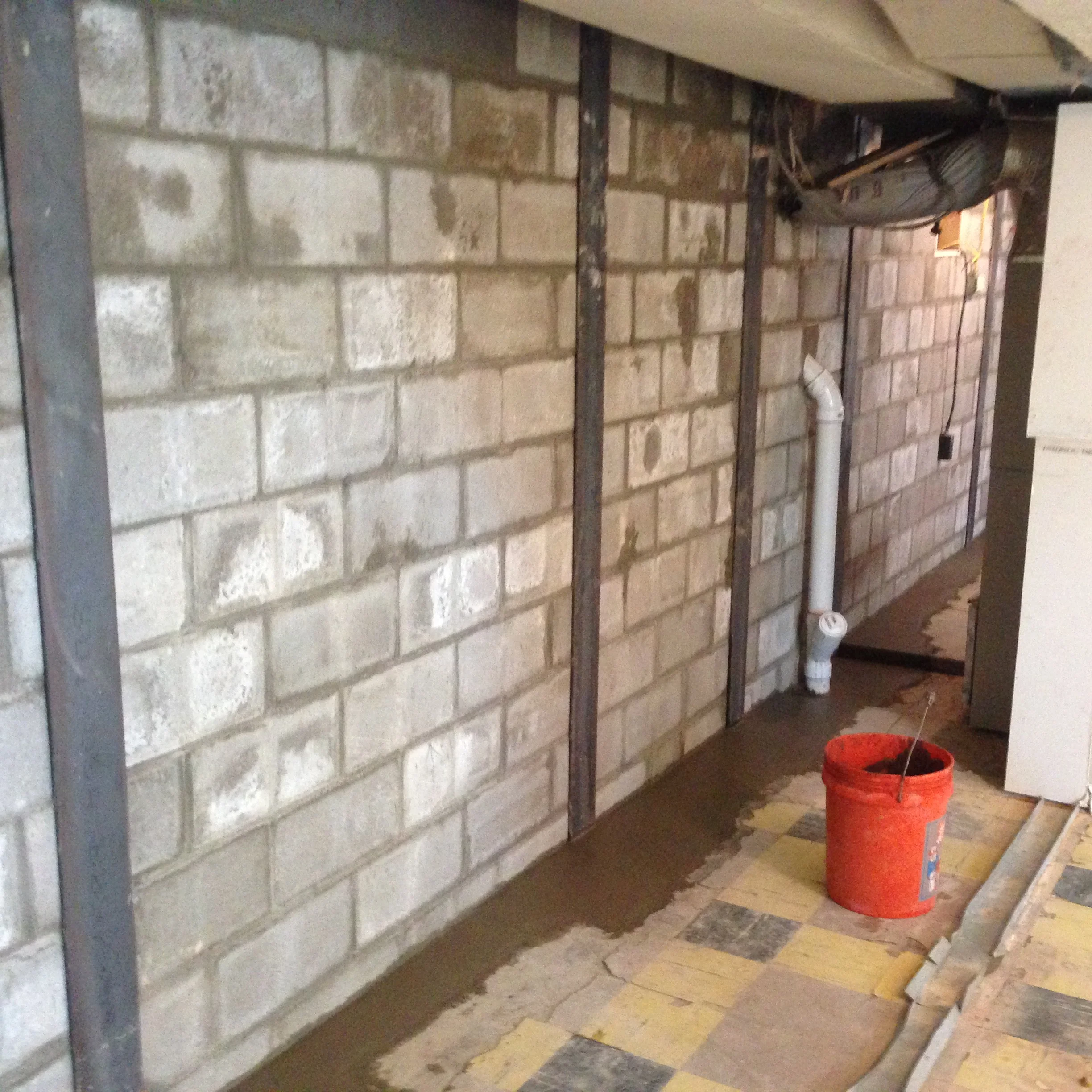 Basement wall after foundation repair and waterproofing