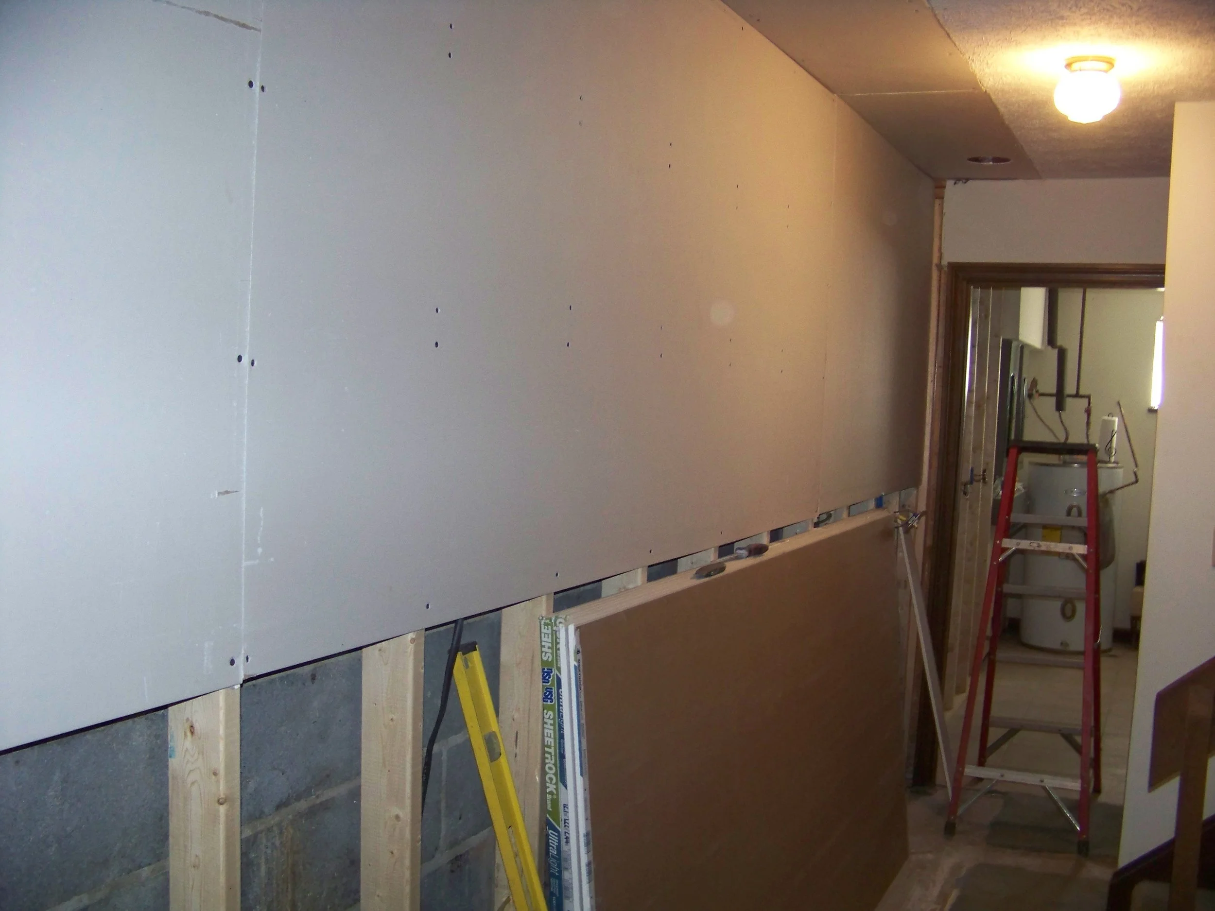 Finishing the almost beyond repair basement wall