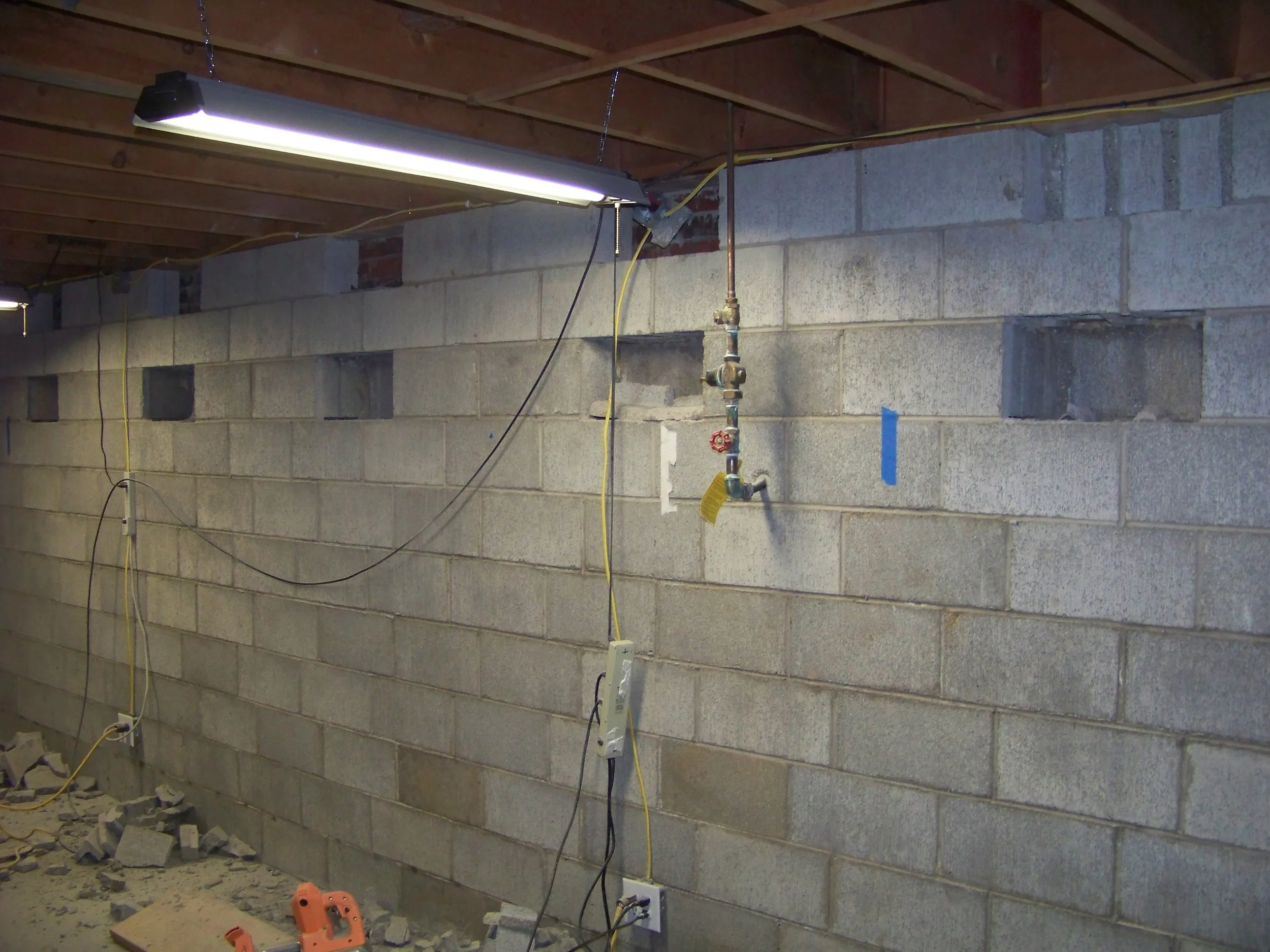 Retrofit basement wall