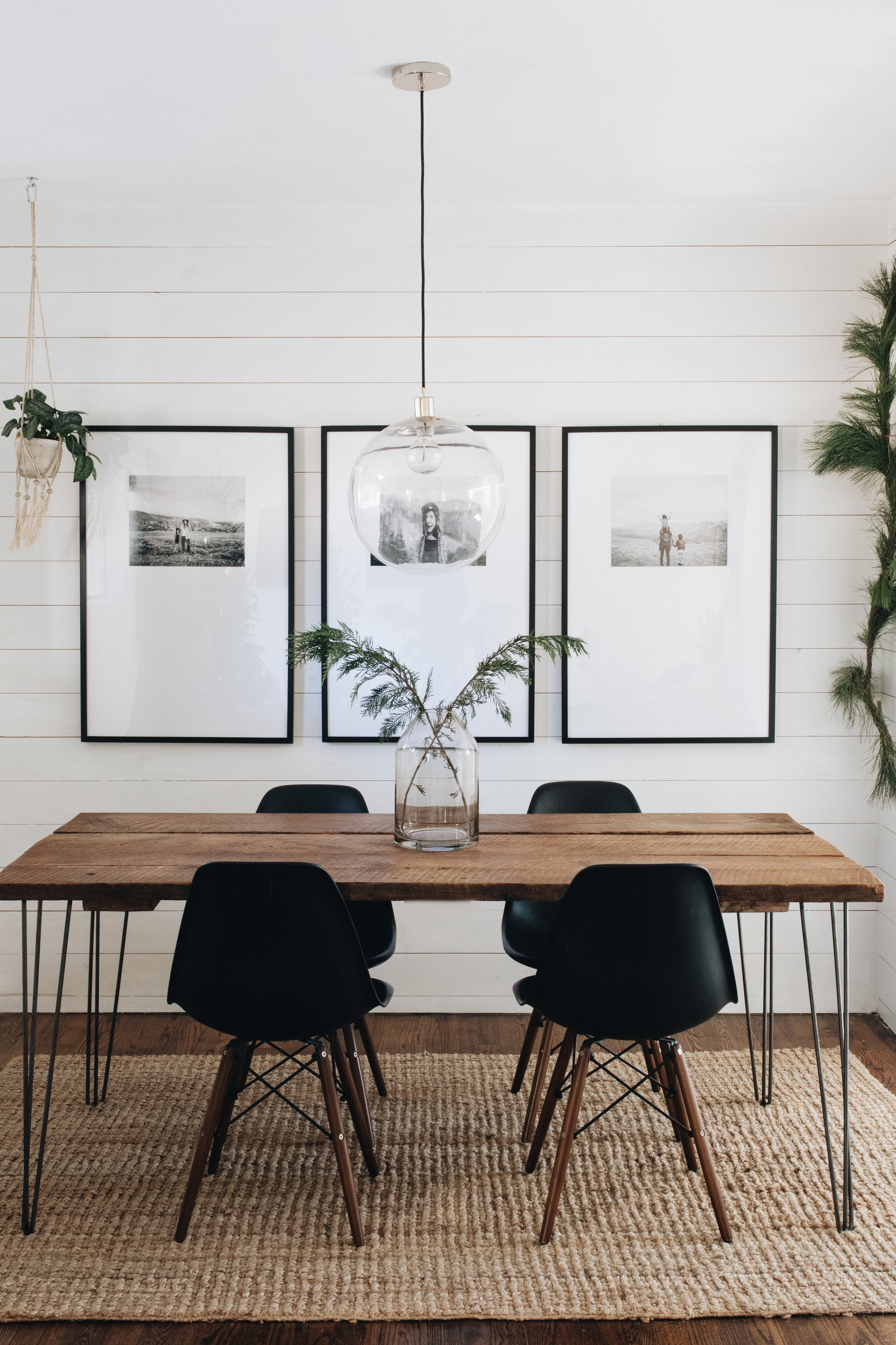 Three black and white photos in large mats and black frames for minimalist dining room decor - how to display art in your house - Leah E. Moss Designs