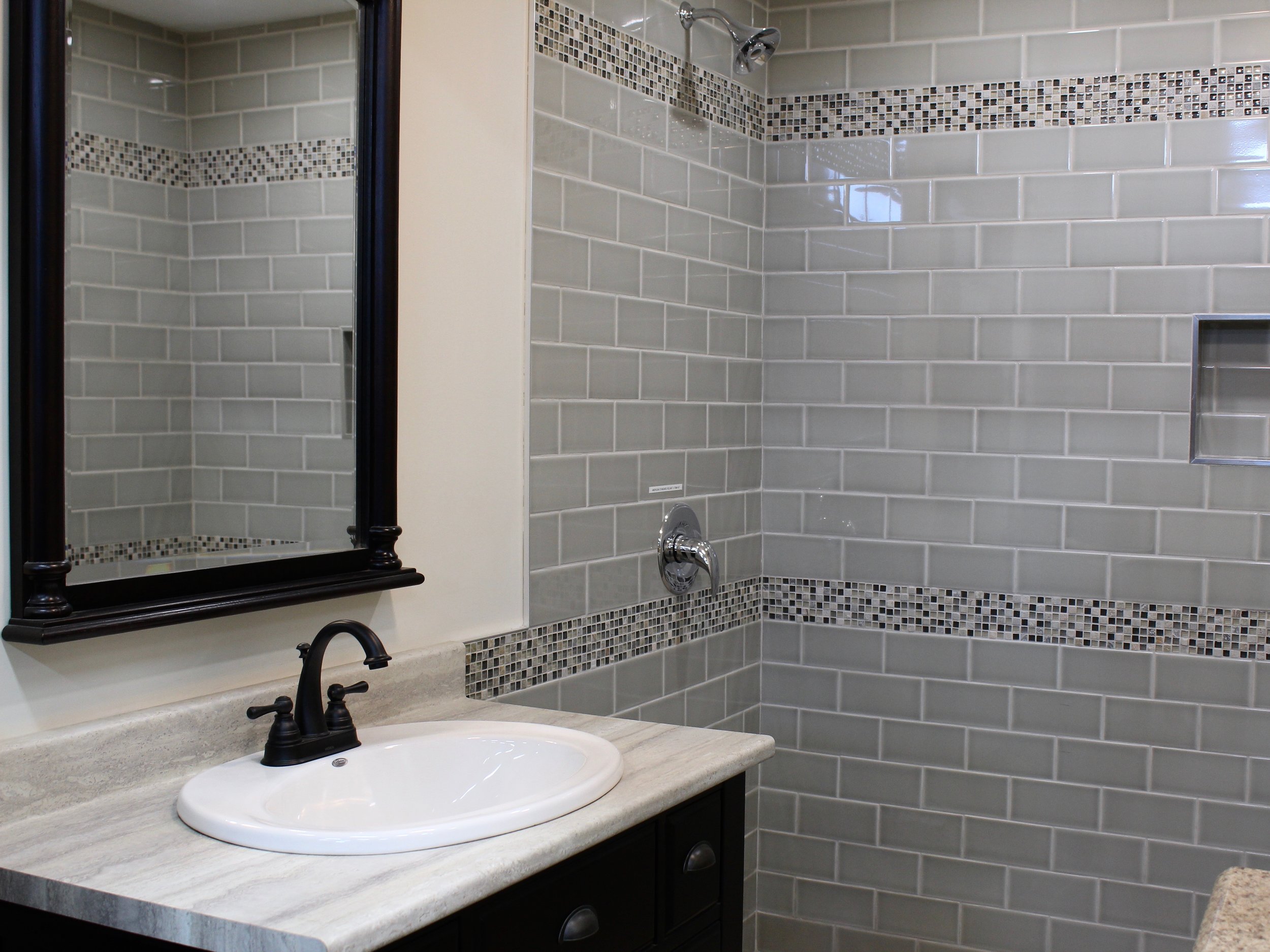 Bathroom with subway tile and mosaics