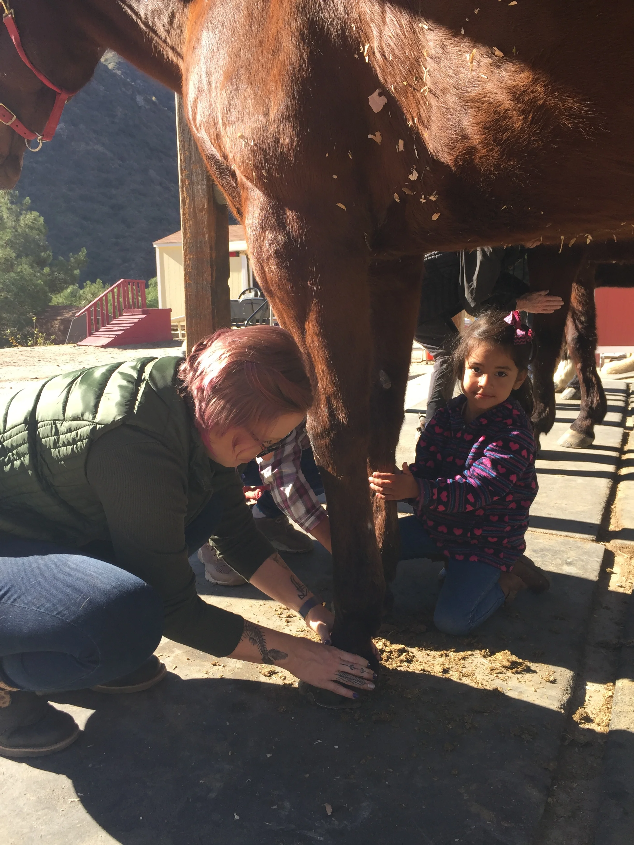 Lizbeth’s daughter helps her mom and Lisa with massaging Lacey’s legs