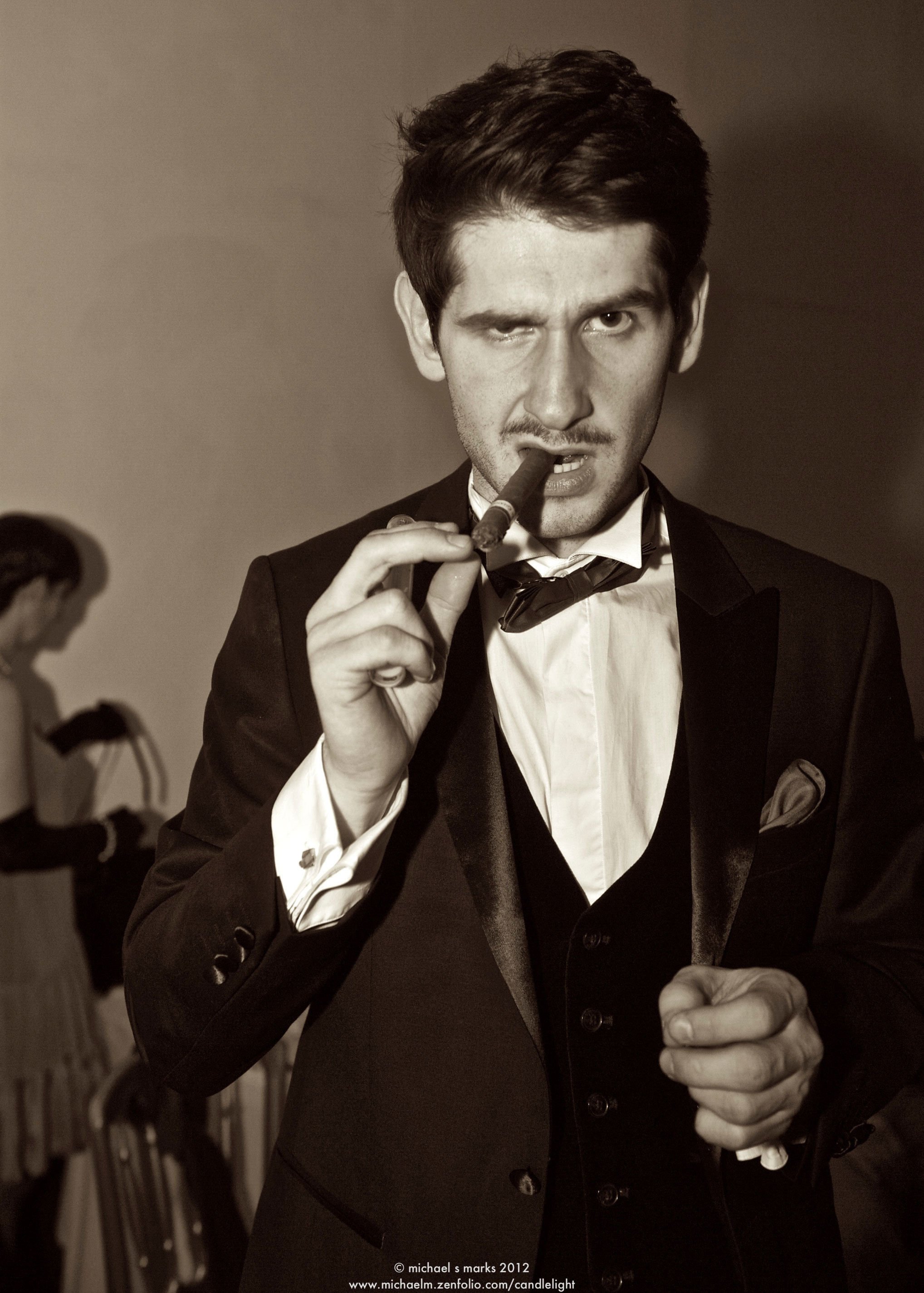 Man in evening wear smoking a cigar