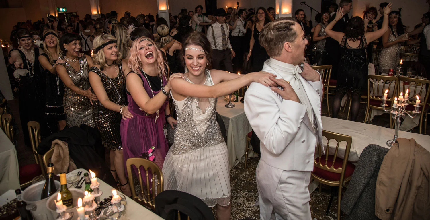 Champagne Charlie leads a conga line