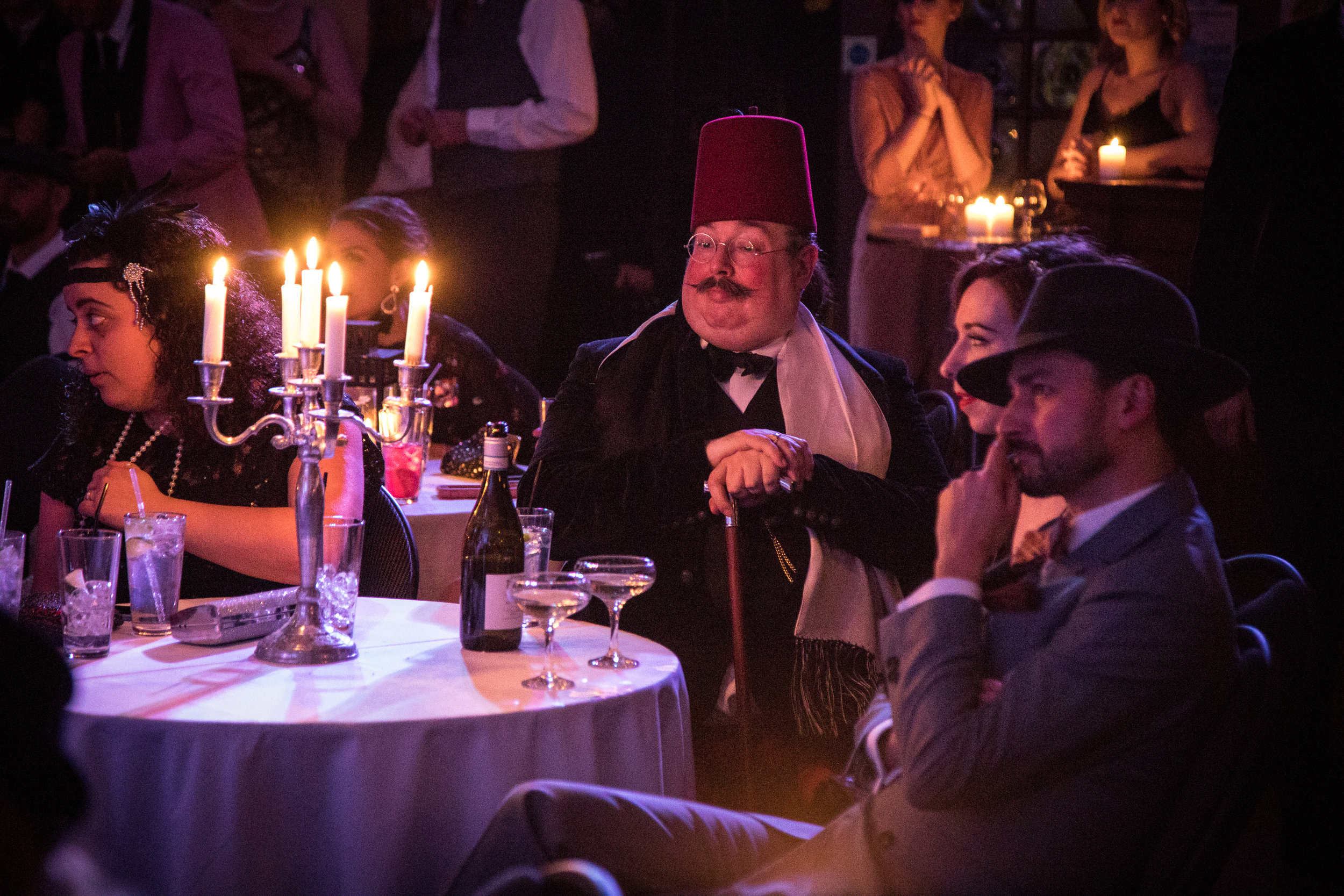 Guest in a fez at the Candlelight Club