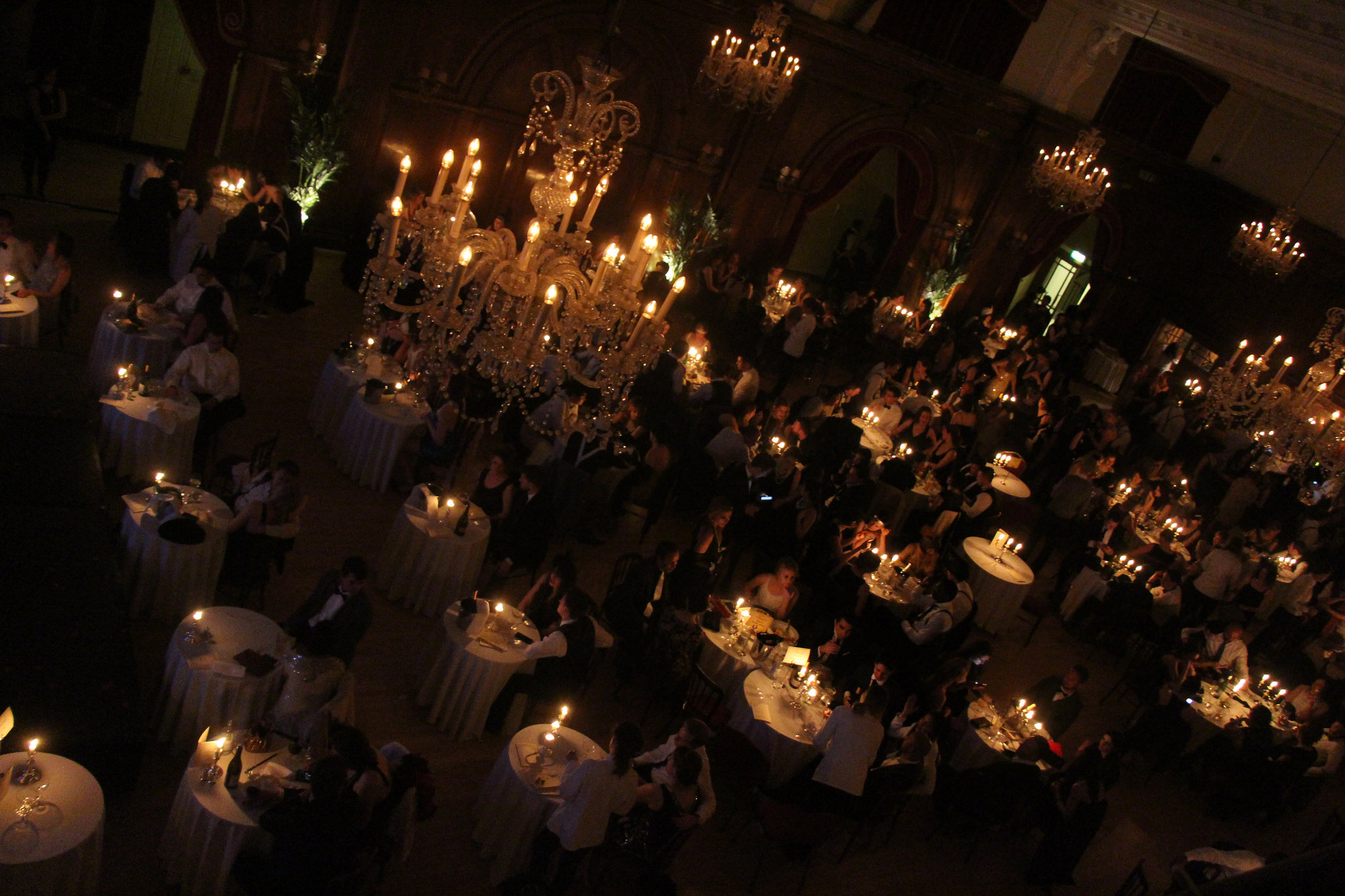 Chandeliers and candlelit tables in the ballroom