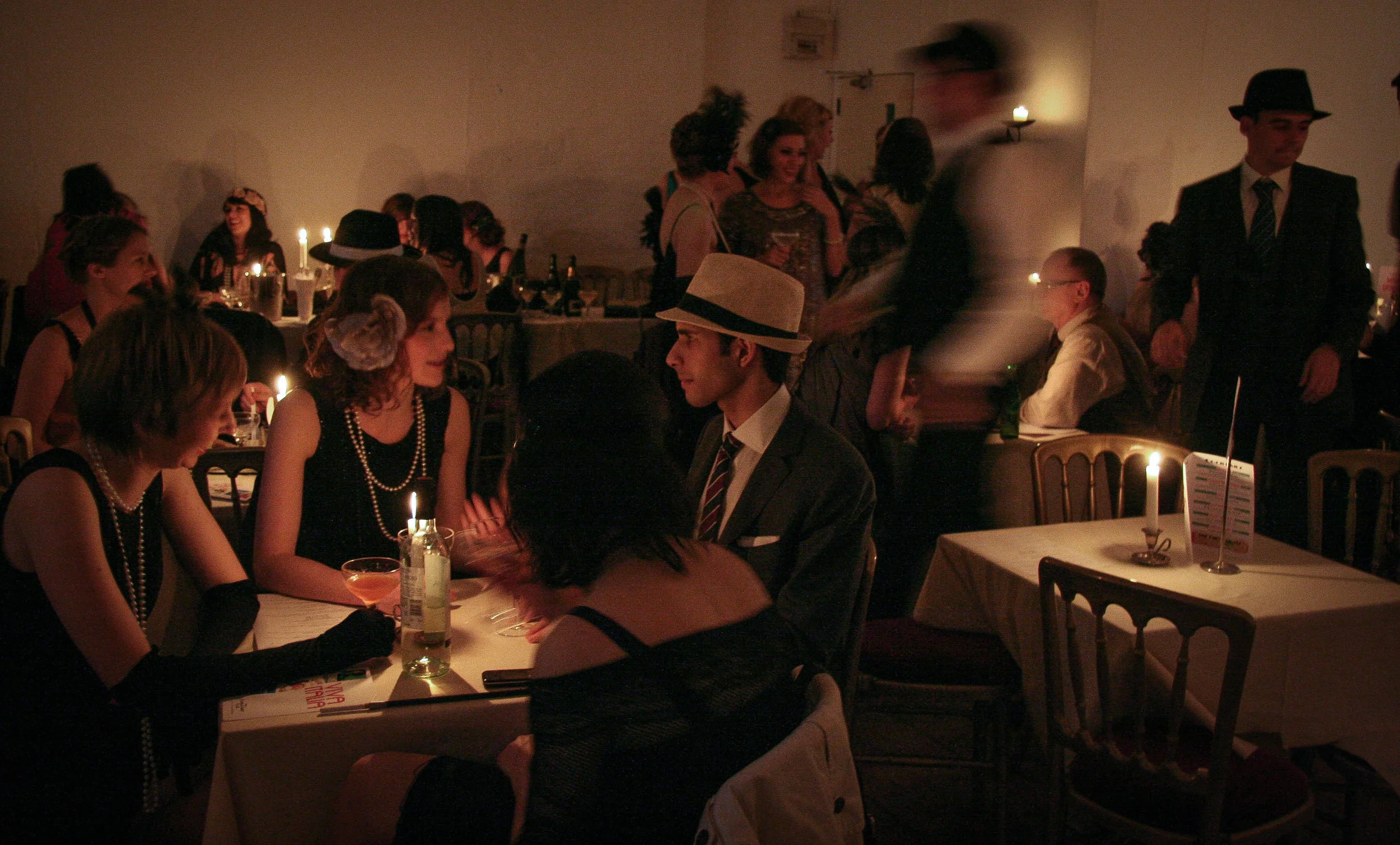 Gangsters and girls at speakeasy tables.jpg