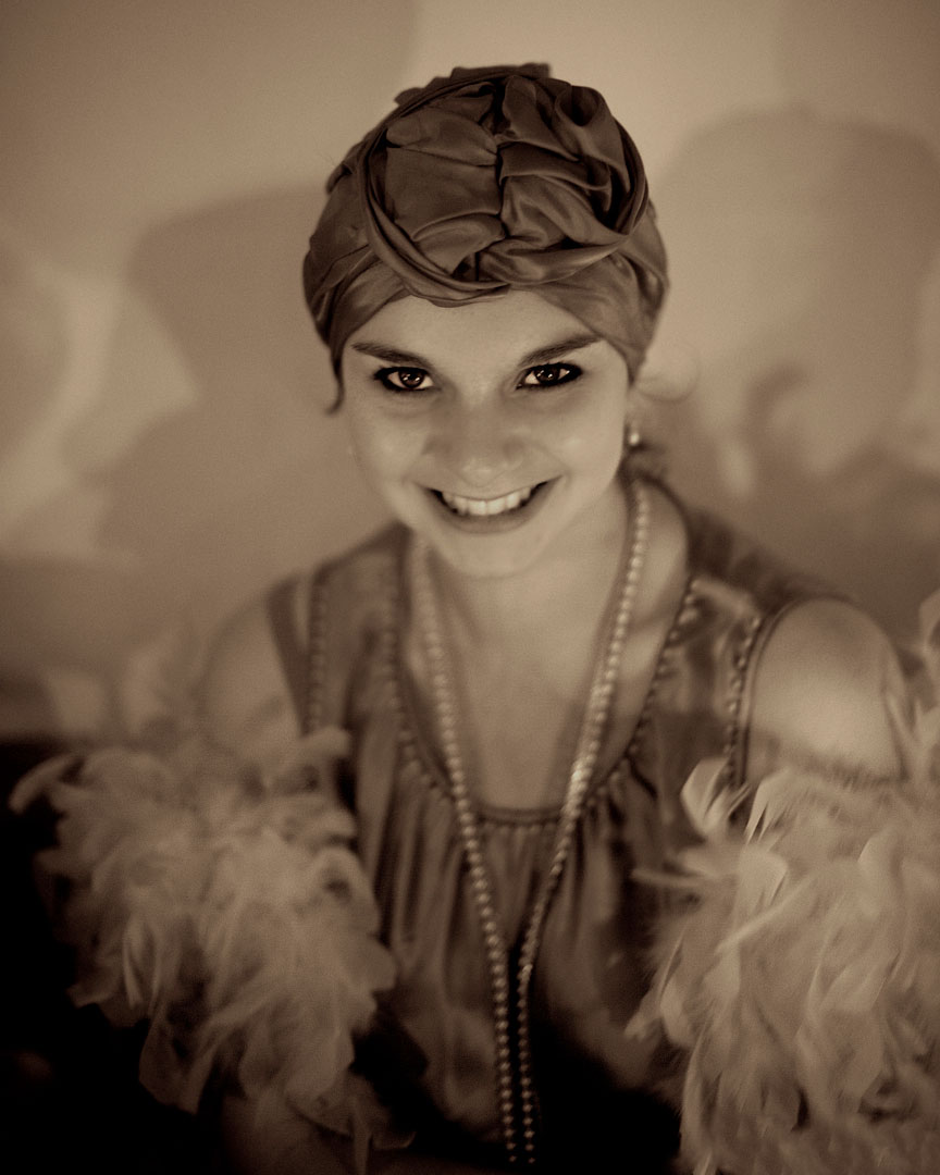 Girl in 1920s turban and boa