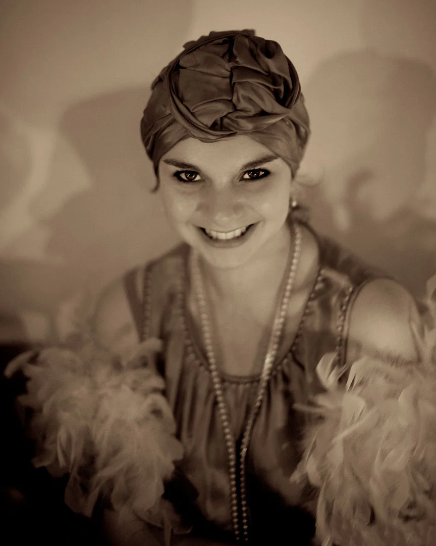 Girl in 1920s turban and boa