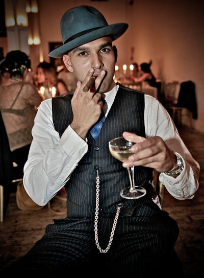 Man in pinstripe gangster suit with cigar