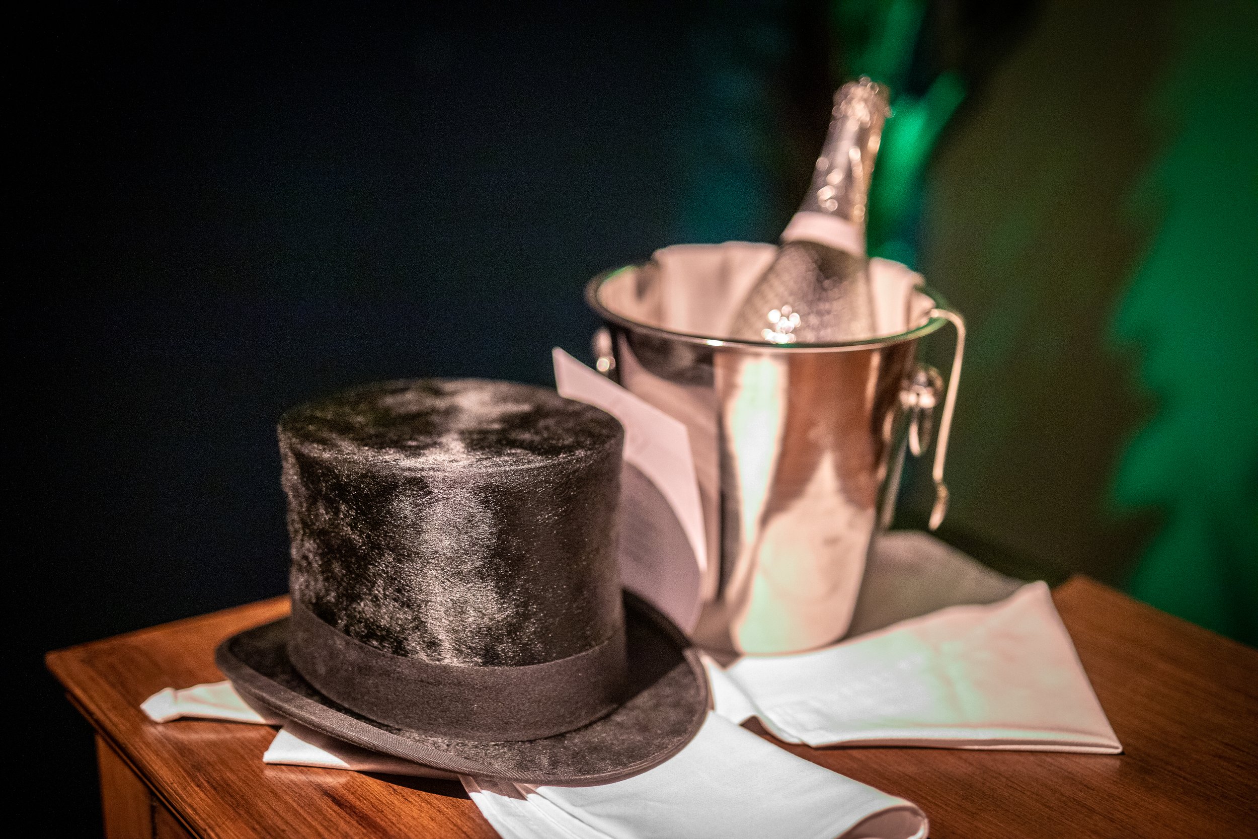 A top hat and a Champagne ice bucket