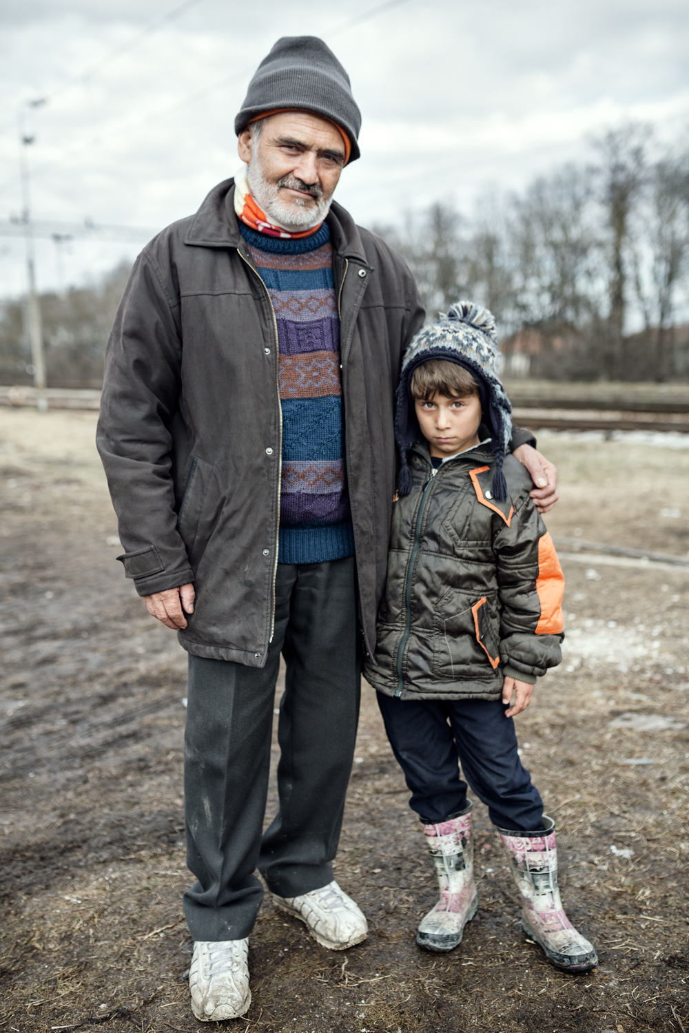  Abdala and his grandson, 6, wait for the train in Presevo station. Serbia, January 2016. They have traveled alone from Afghanistan on the way to the UK. 