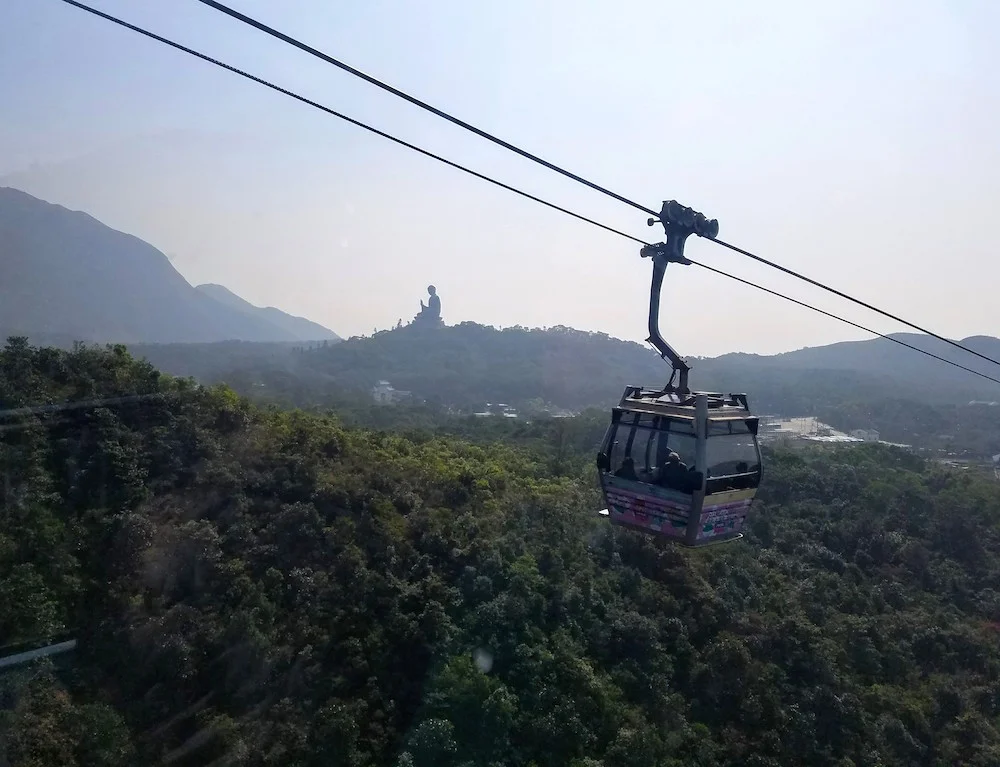 The Big Buddha in the distance, seen by cable car