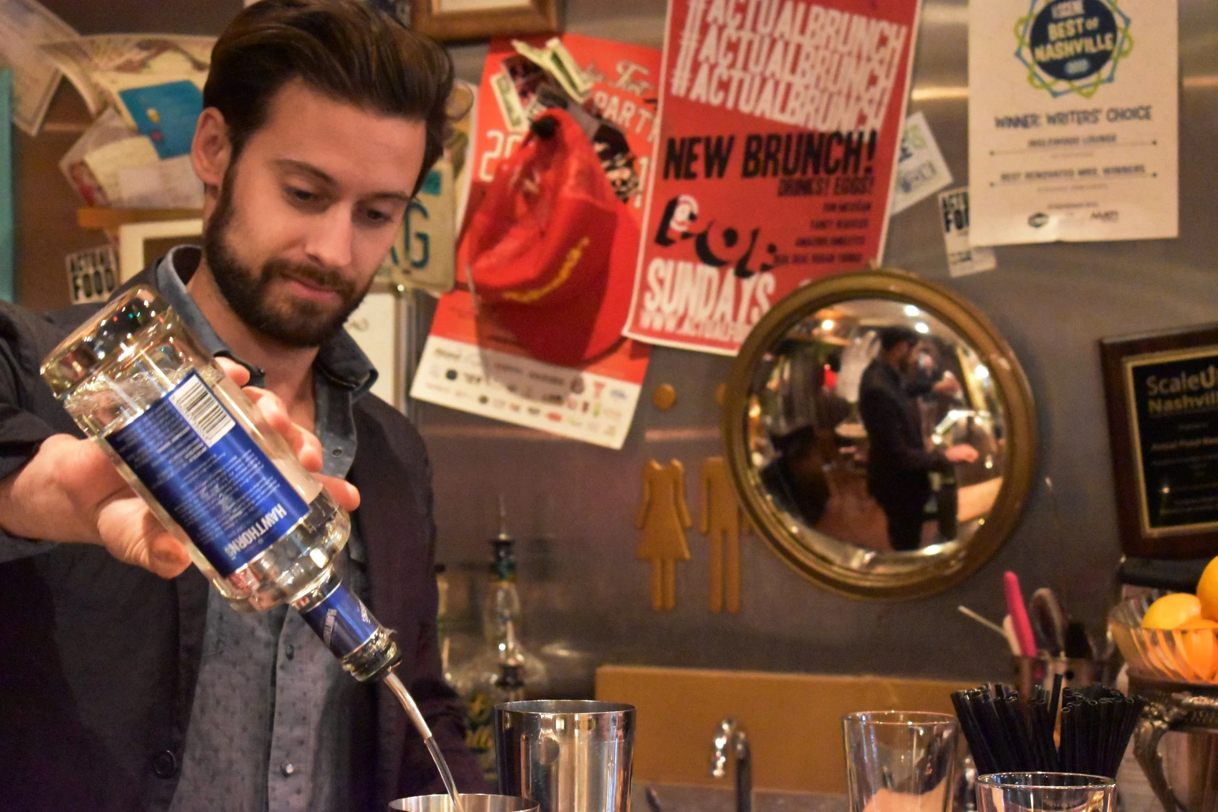 Owner Dan Forberg pours a drink behind the bar at Inglewood Lounge.
