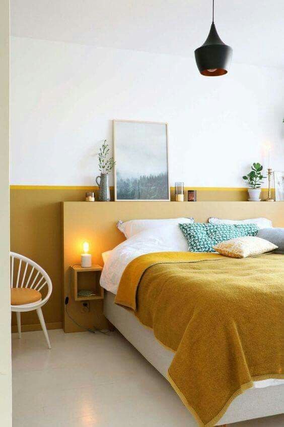 Rich gold tones make this room feel warm and optimistic without being too shockingly bright. Modern, simplistic furniture and accessories help keep the room from feeling like a 70s flashback. The monochromatic color scheme feels fresh, not busy, and the white space provides plenty of blank space that doesn’t overwhelm. A single built-out shelf keeps accessories at one level, eliminating any unnecessary visual clutter.