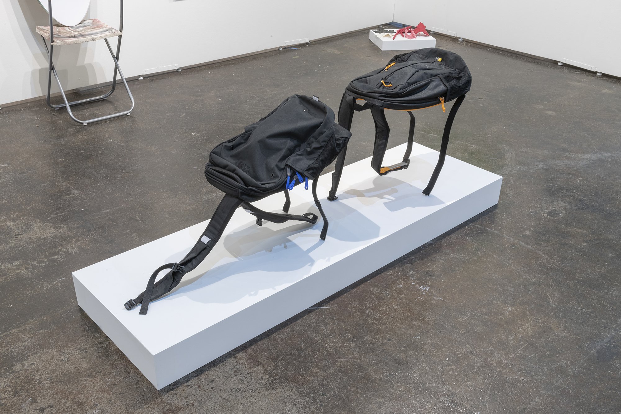  Xenia Bond  Butt Sniffers , 2021 Steel, found backpacks Dimensions variable 