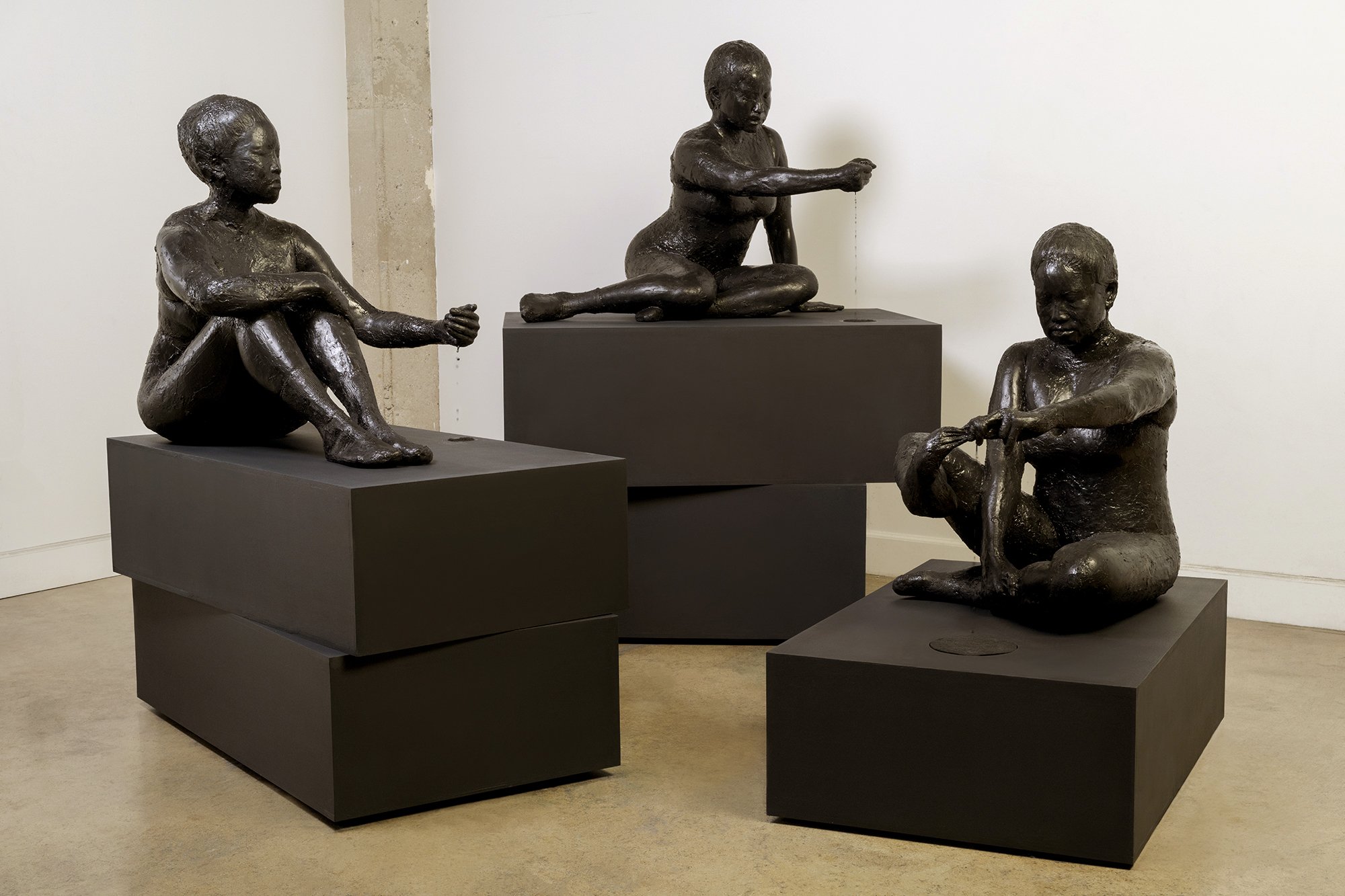  Ellen Jong  The Three Shades , 2025 Handmade dehydrated-solid and liquid ink on pedestals with fountain components 65 x 115 x 80 inches overall 