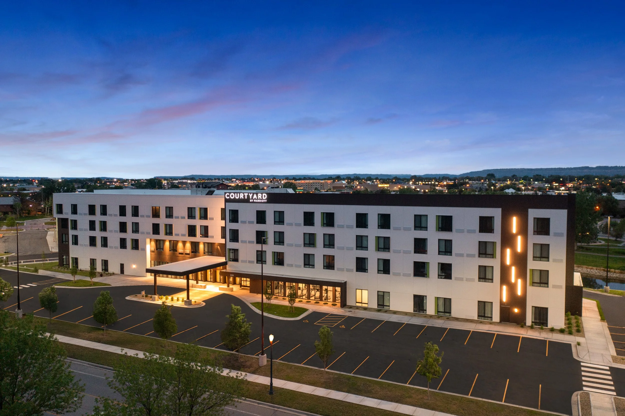 courtyard billings drone exterior dusk.jpg